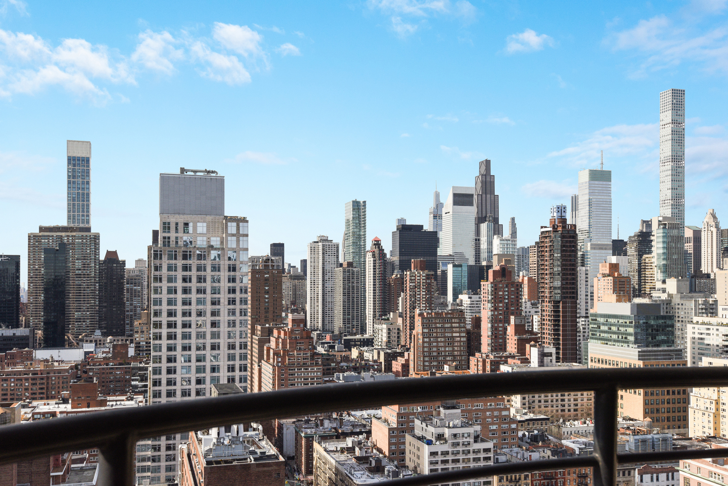 400 East 70th Street, Unit 3005 Manhattan, NY 10021 - Photo 6 of 18 a view of a city skyline from a balcony