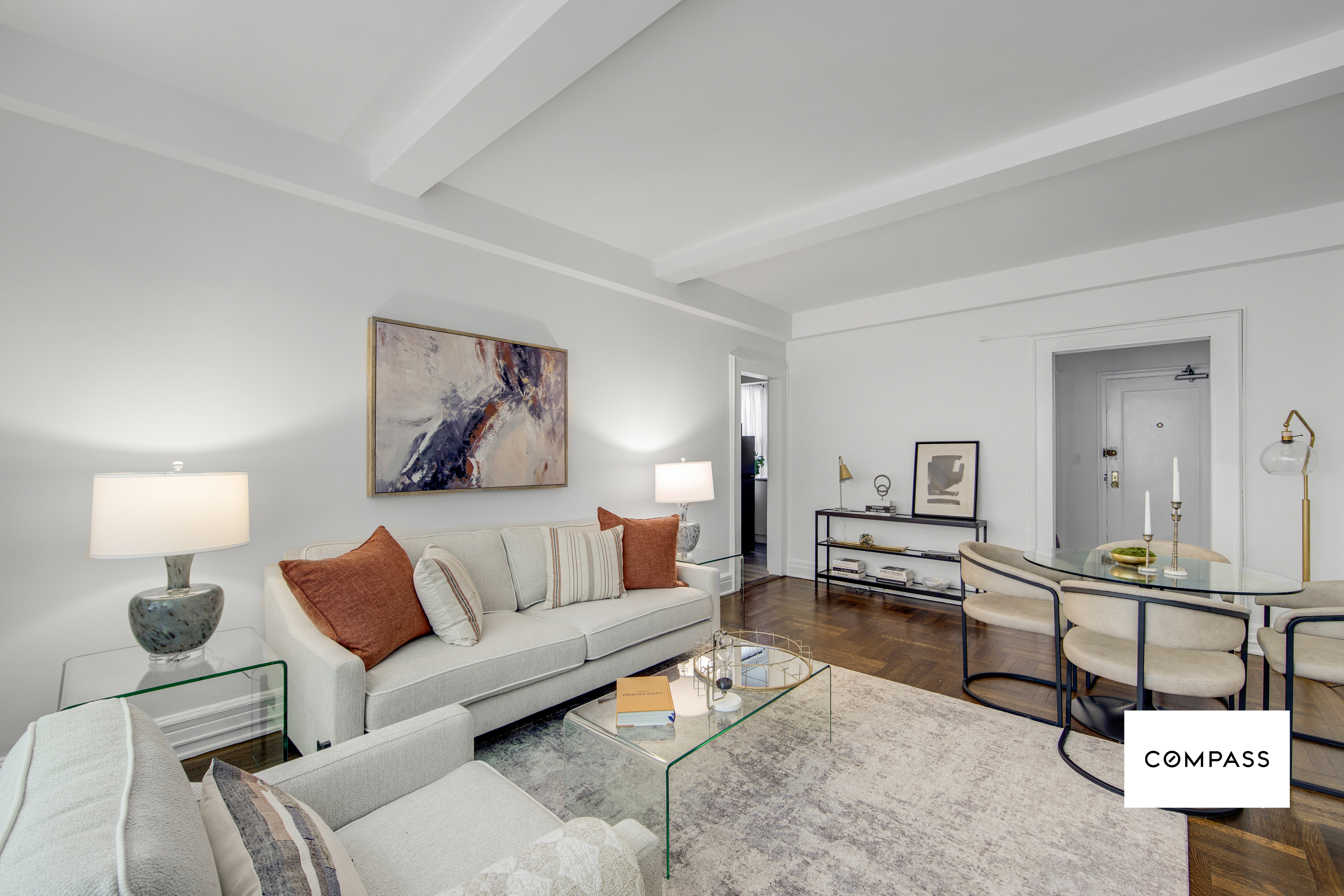 124 East 84th Street, Unit 1D Manhattan, NY 10028 - Photo 3 of 14 a living room with furniture and a lamp