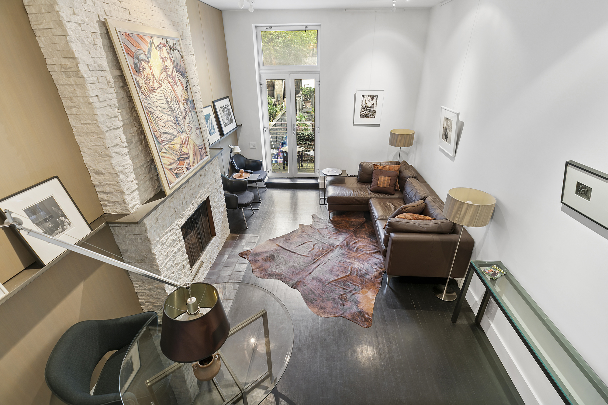 133 East 15th Street, Unit 1B Manhattan, NY 10003 - Photo 3 of 12 a living room with furniture and a fireplace