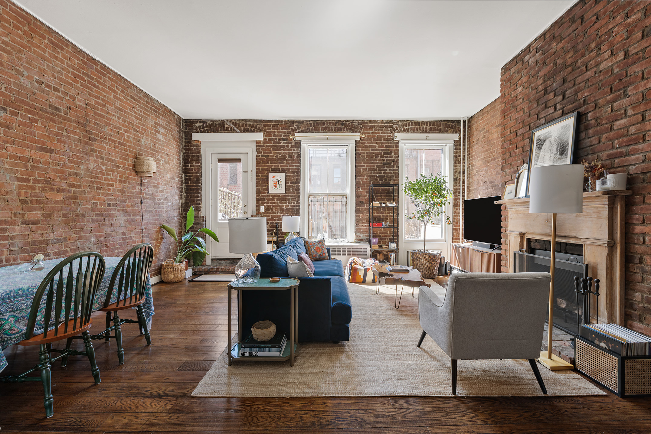 138 West 73rd Street Manhattan, NY 10023 - Photo 19 of 35 a living room with fireplace furniture and a large window