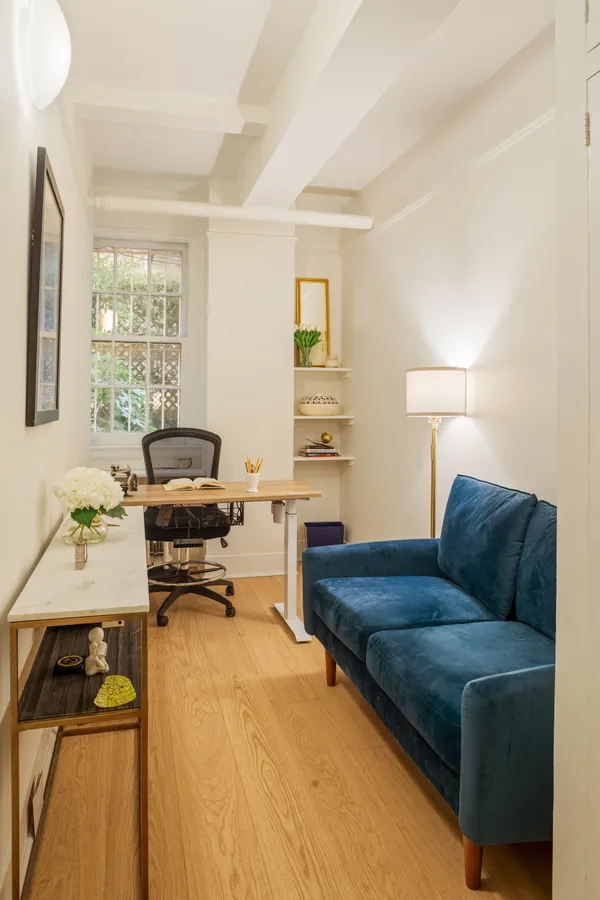 a living room with furniture and a table