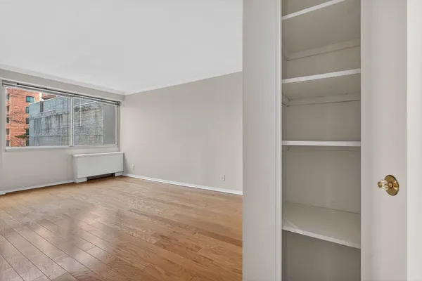 a view of an empty room with a window