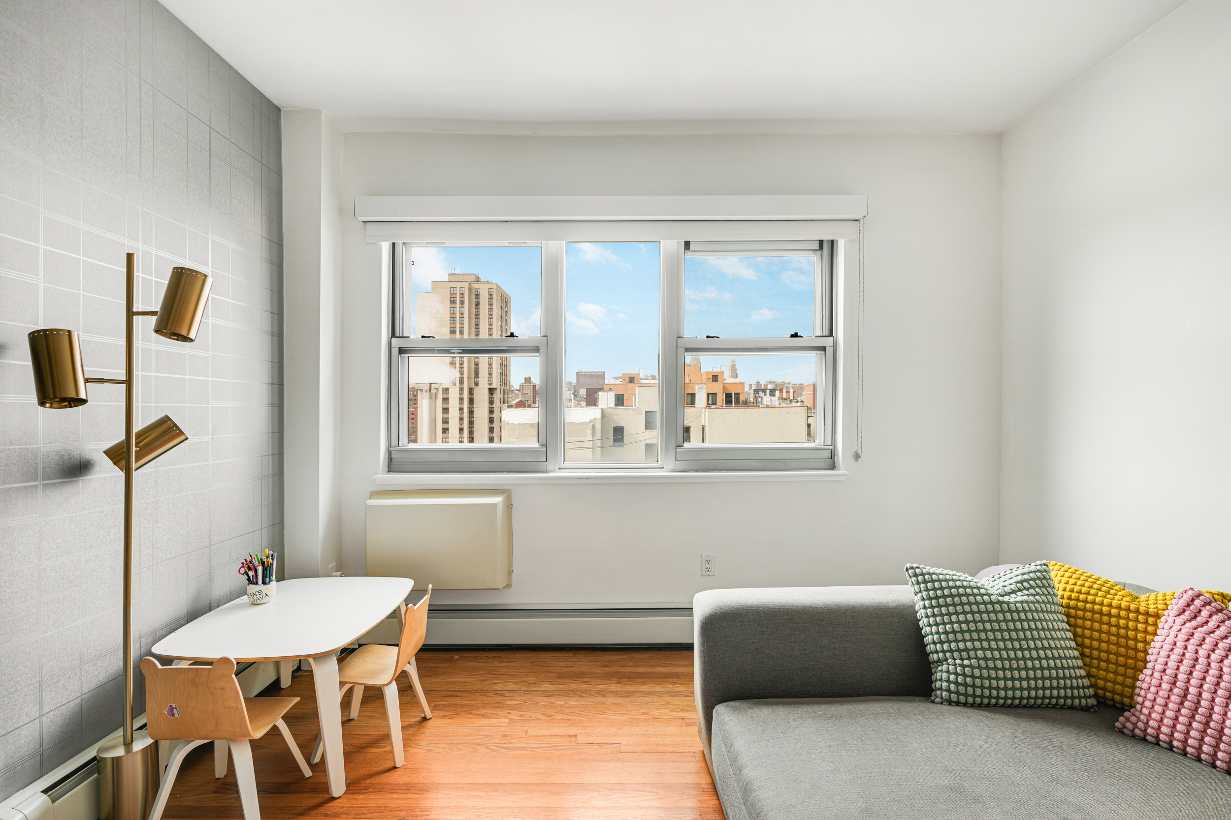 1820 Madison Avenue, Unit 7C Manhattan, NY 10035 - Photo 3 of 17 a living room with furniture and a window