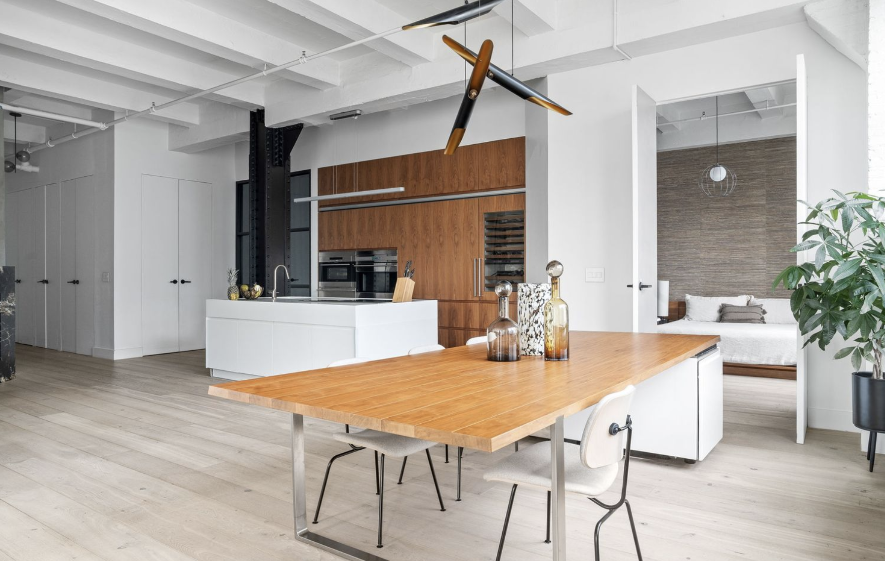 448 West 37th Street, Unit 8C Manhattan, NY 10018 - Photo 5 of 10 a dining room with a table and chairs