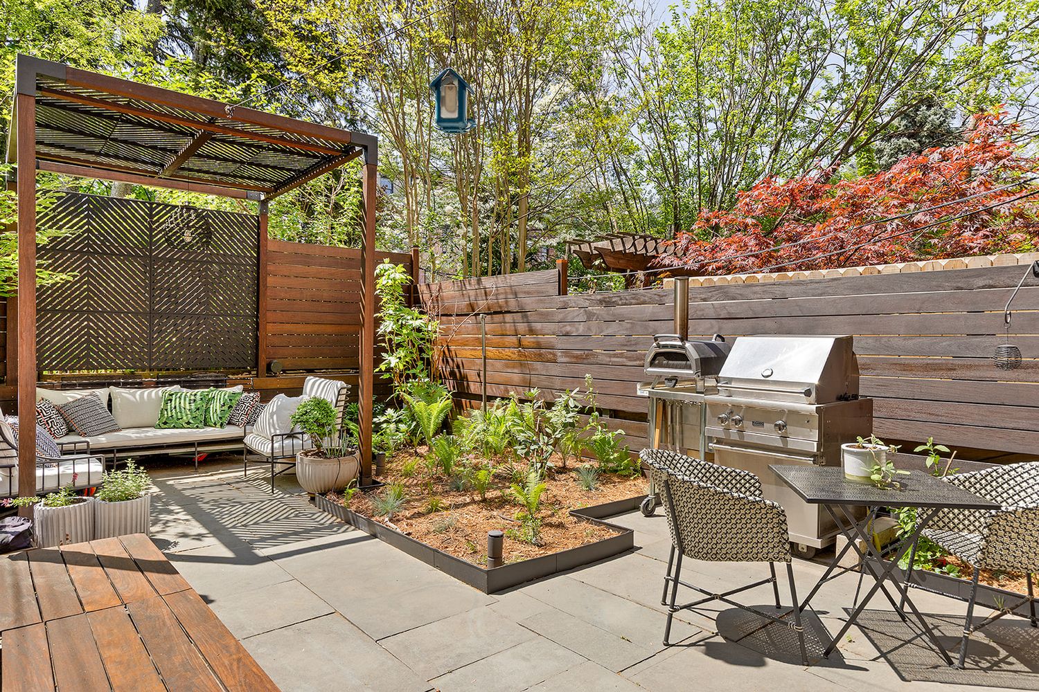 a view of a backyard with sitting area