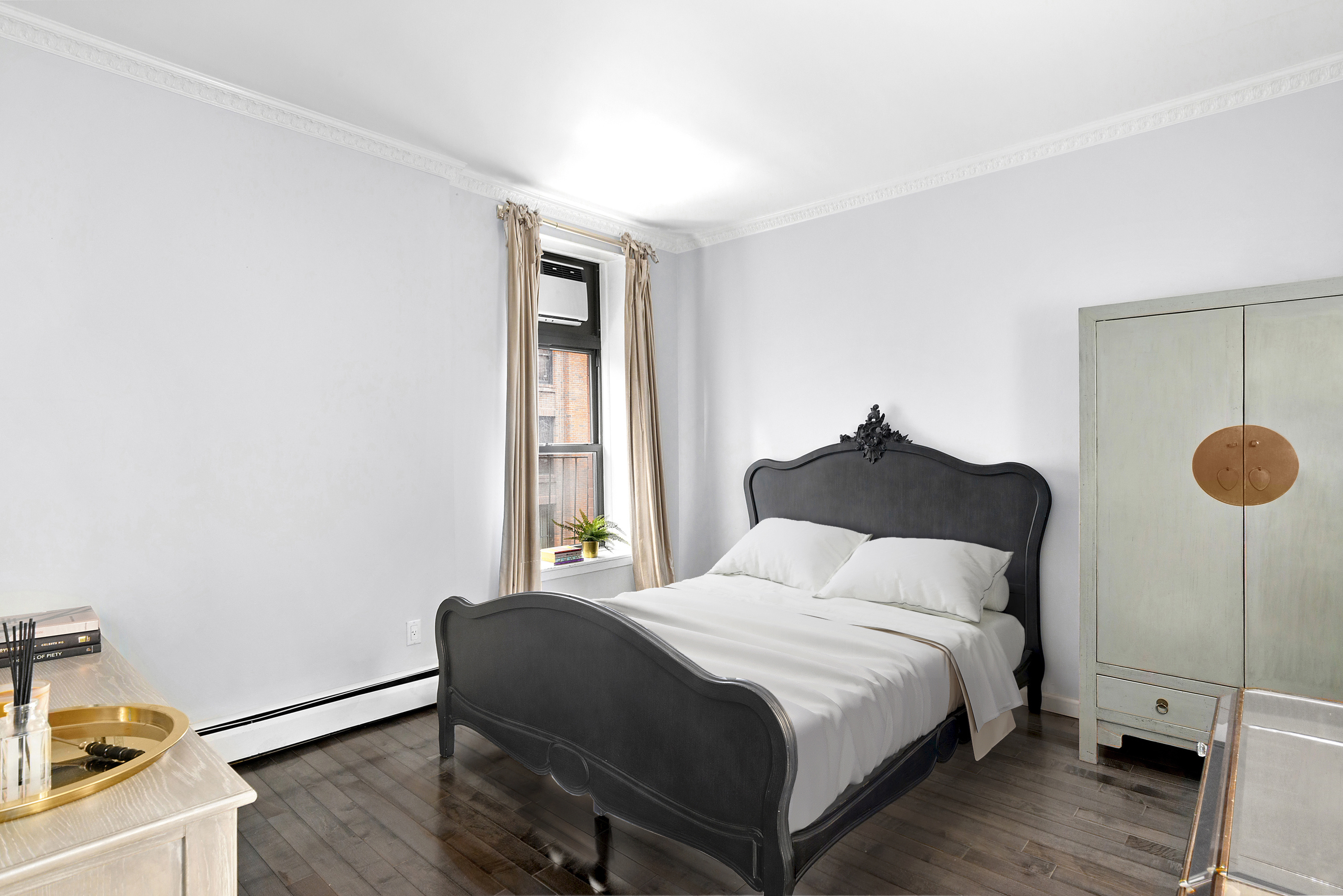 14 Prince Street, Unit 3F Manhattan, NY 10012 - Photo 4 of 6 a bedroom with a bed and a window