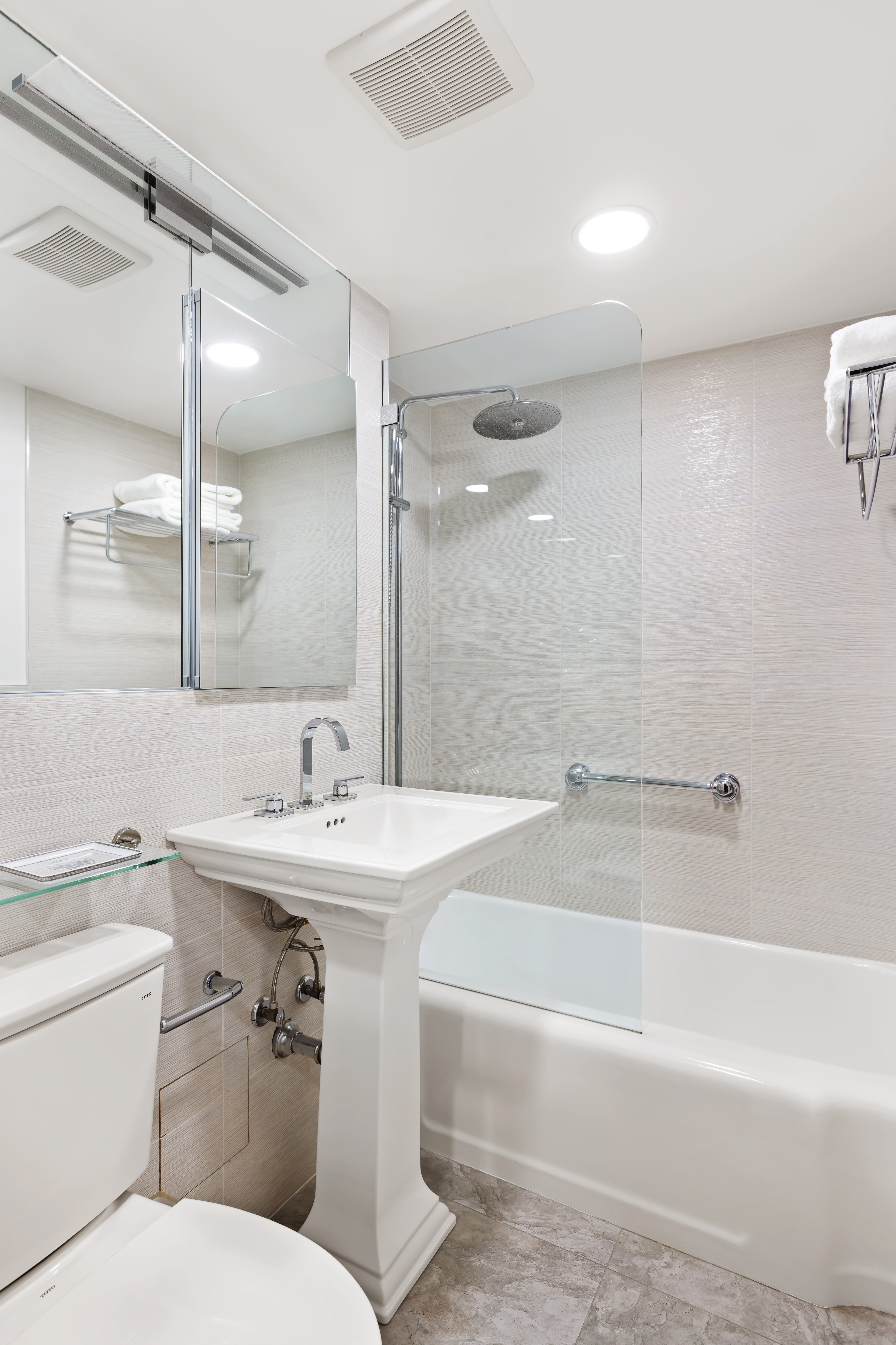 750 Park Avenue, Unit 5B Manhattan, NY 10021 - Photo 9 of 11 a bathroom with a sink toilet tub and shower