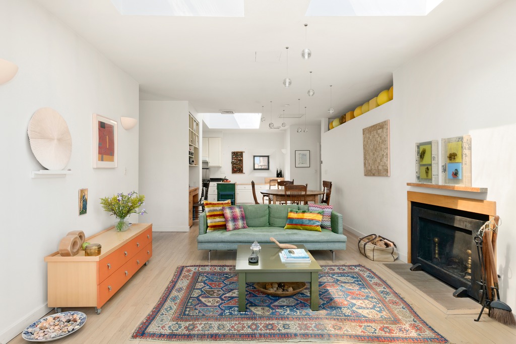 205 West 89th Street, Unit PH6/7 Manhattan, NY 10024 - Photo 3 of 20 a living room with furniture and a fireplace