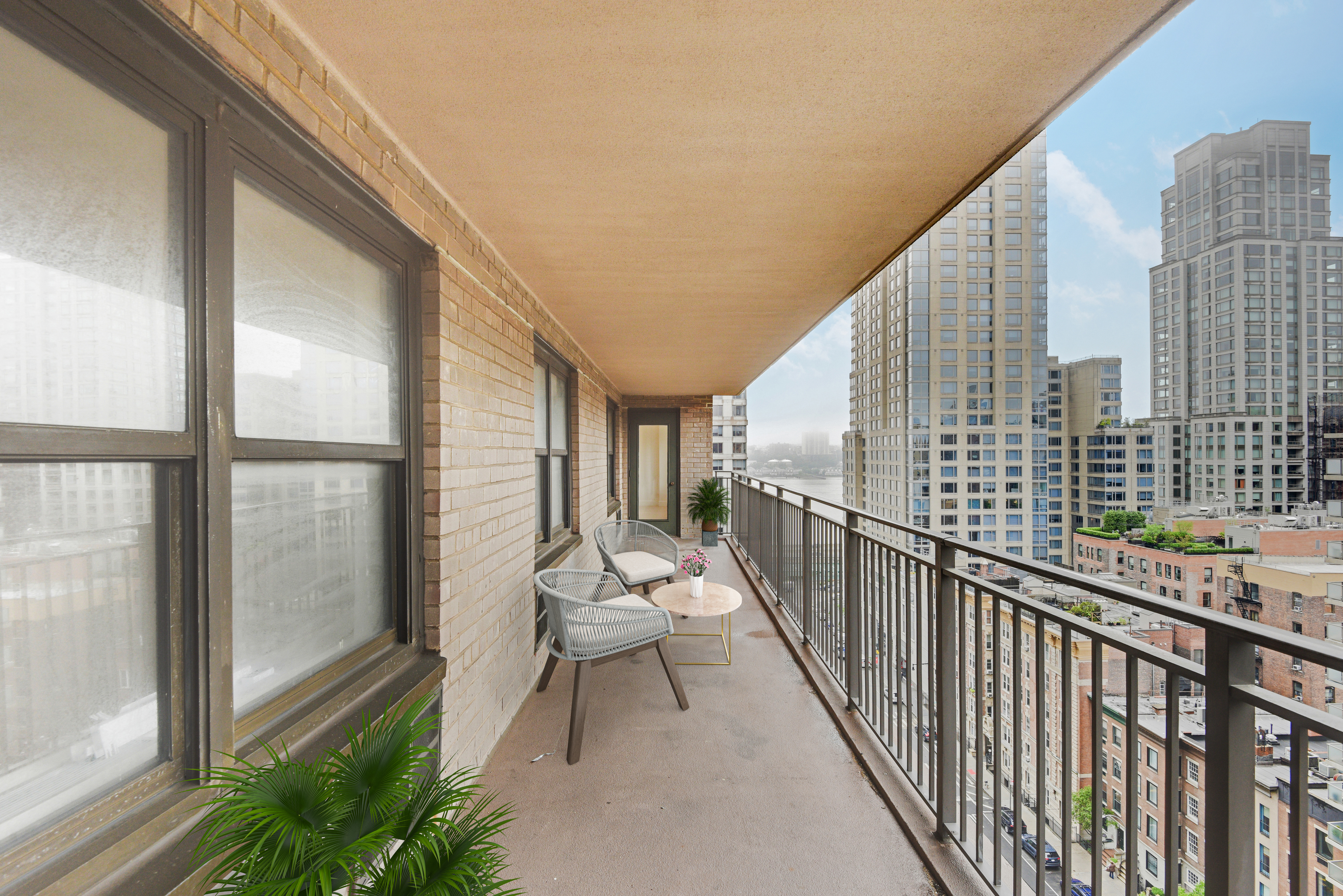205 West End Avenue, Unit 15H Manhattan, NY 10023 - Photo 14 of 17 a balcony with wooden floor and outdoor seating