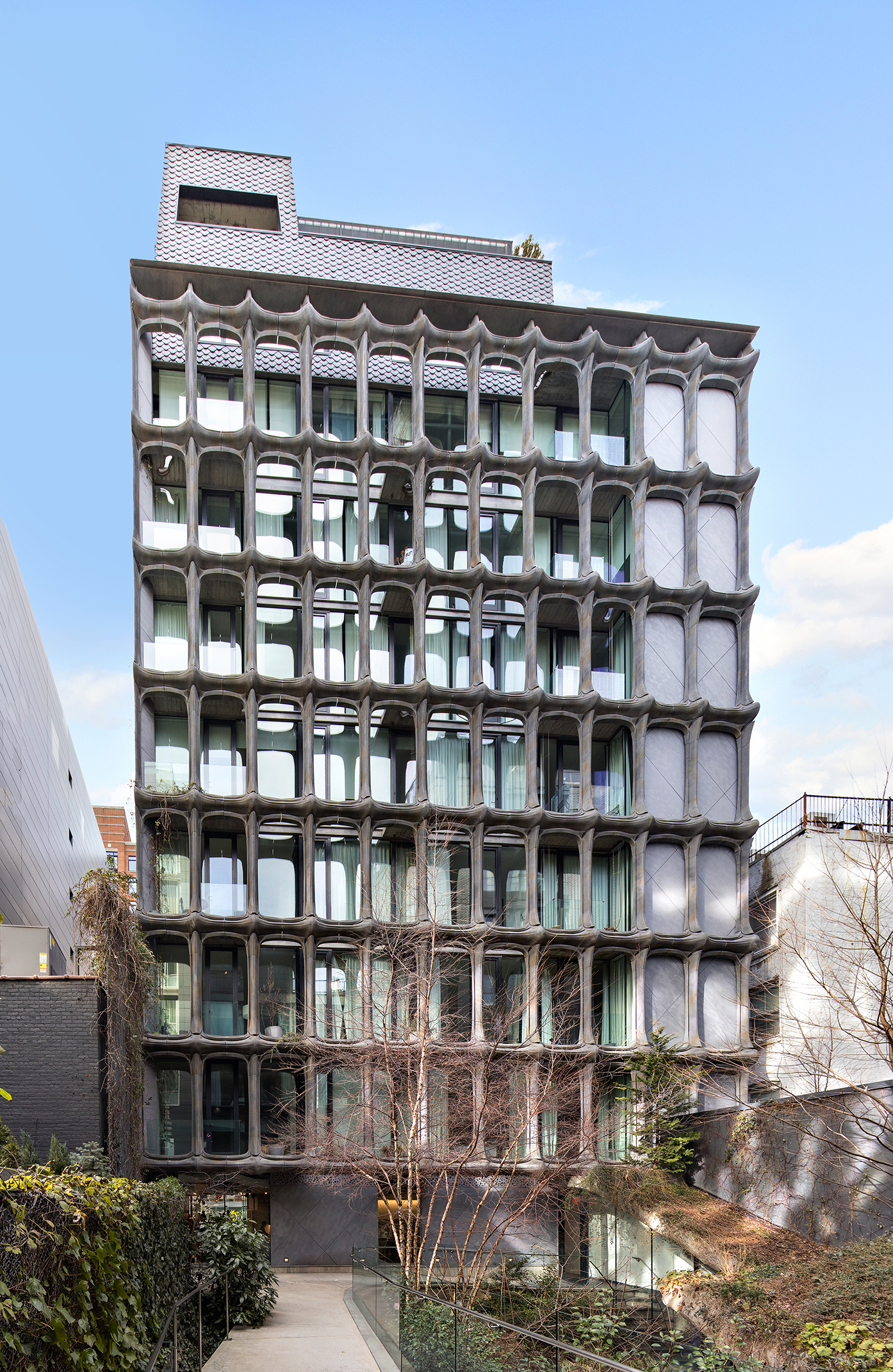 325 West Broadway, Unit 4B Manhattan, NY 10013 - Photo 16 of 17 a front view of a building with a lot of windows