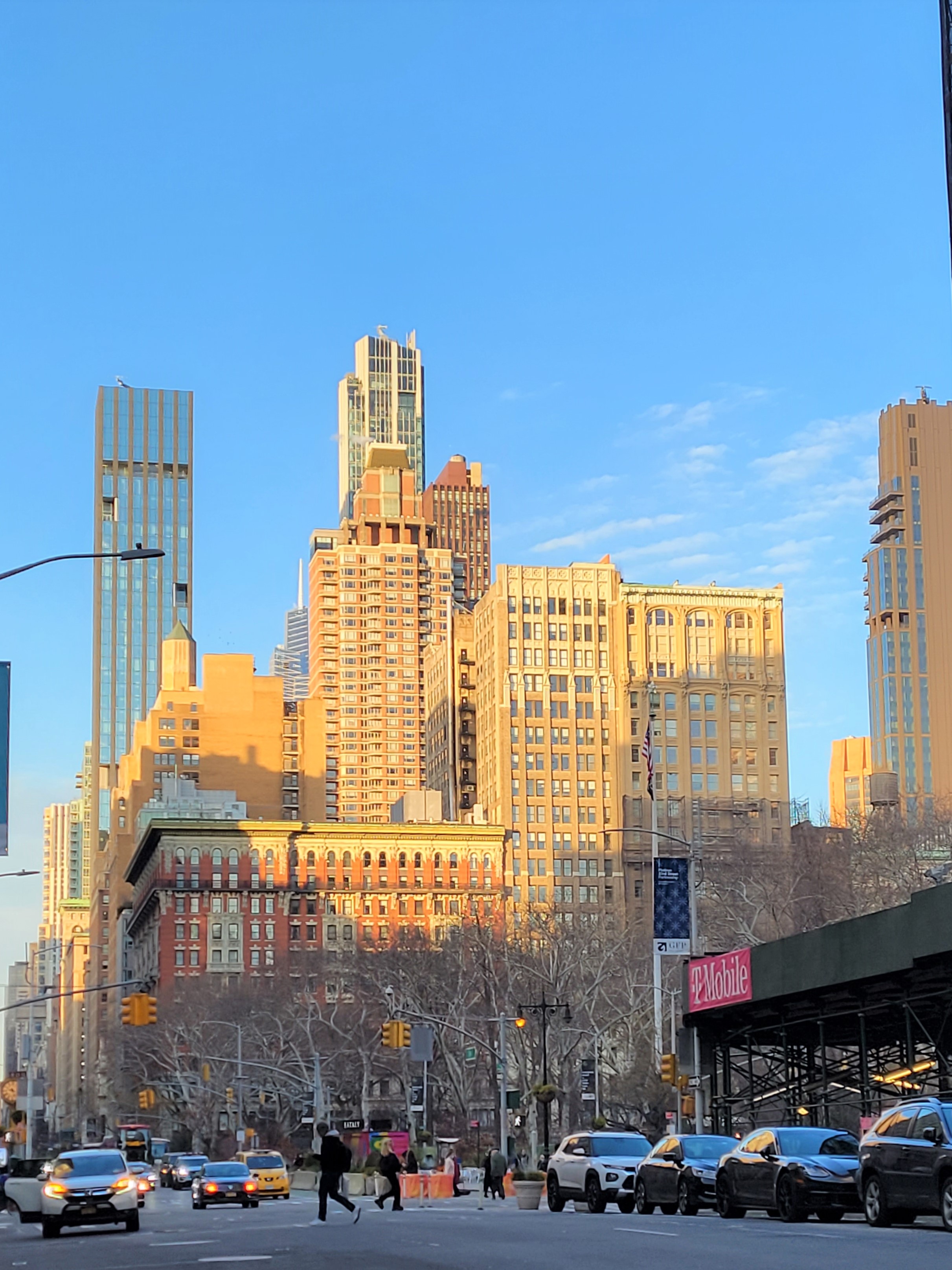 172 5th Avenue, Unit 2F Manhattan, NY 10010 - Photo 9 of 10 a front view of a building with lot of cars and trees