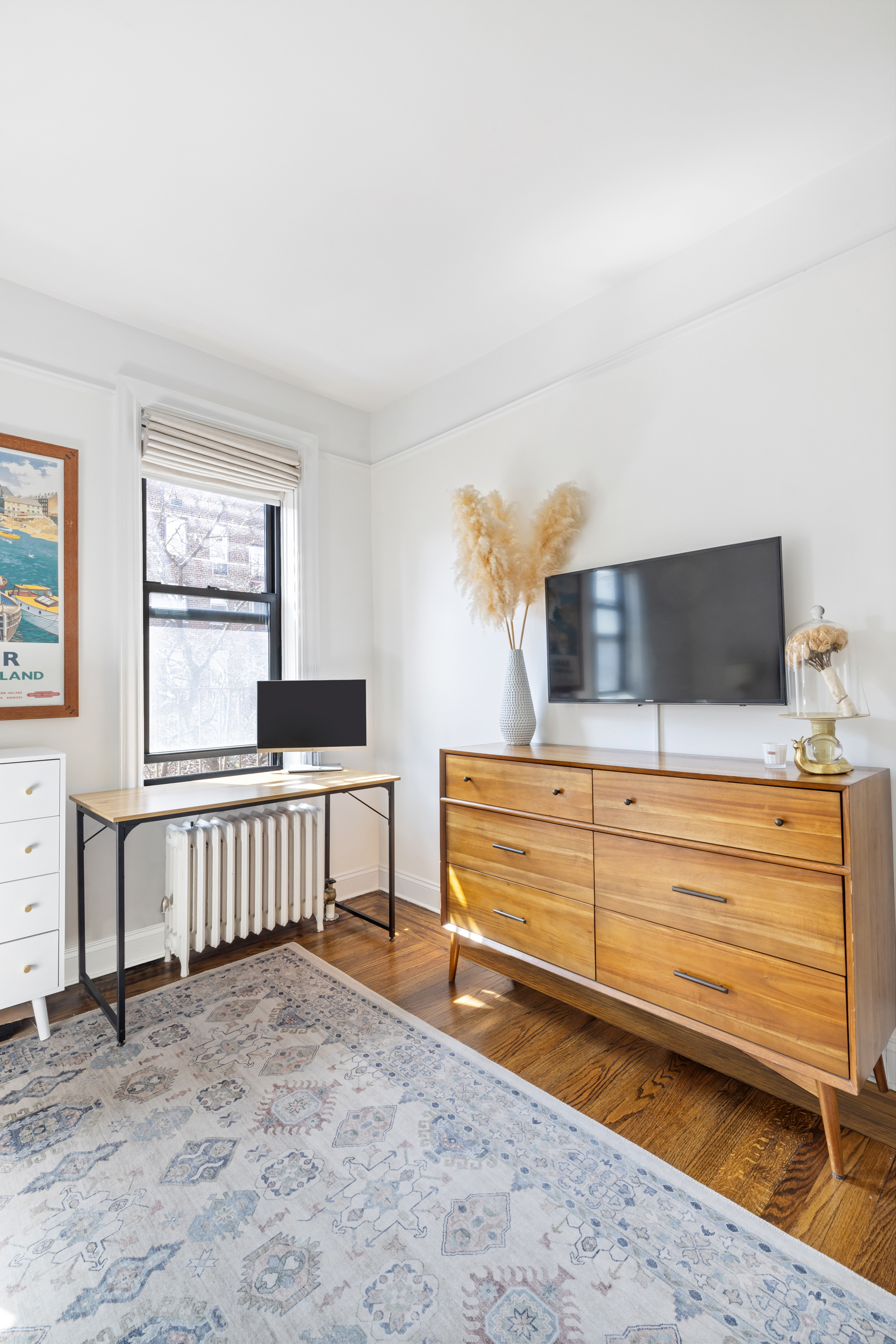 305 East 88th Street, Unit 4A Manhattan, NY 10128 - Photo 4 of 13 a view of living room with furniture and flat screen tv