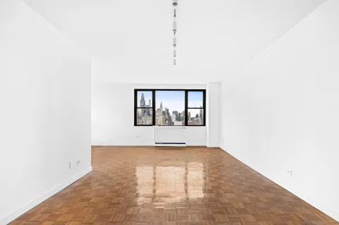 a view of an empty room with a window