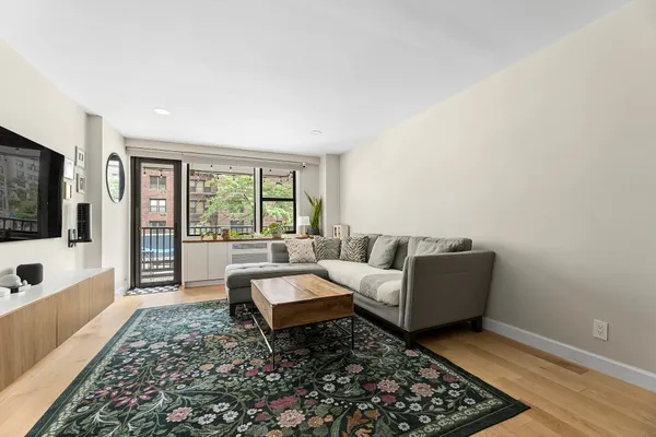 a living room with furniture and a rug