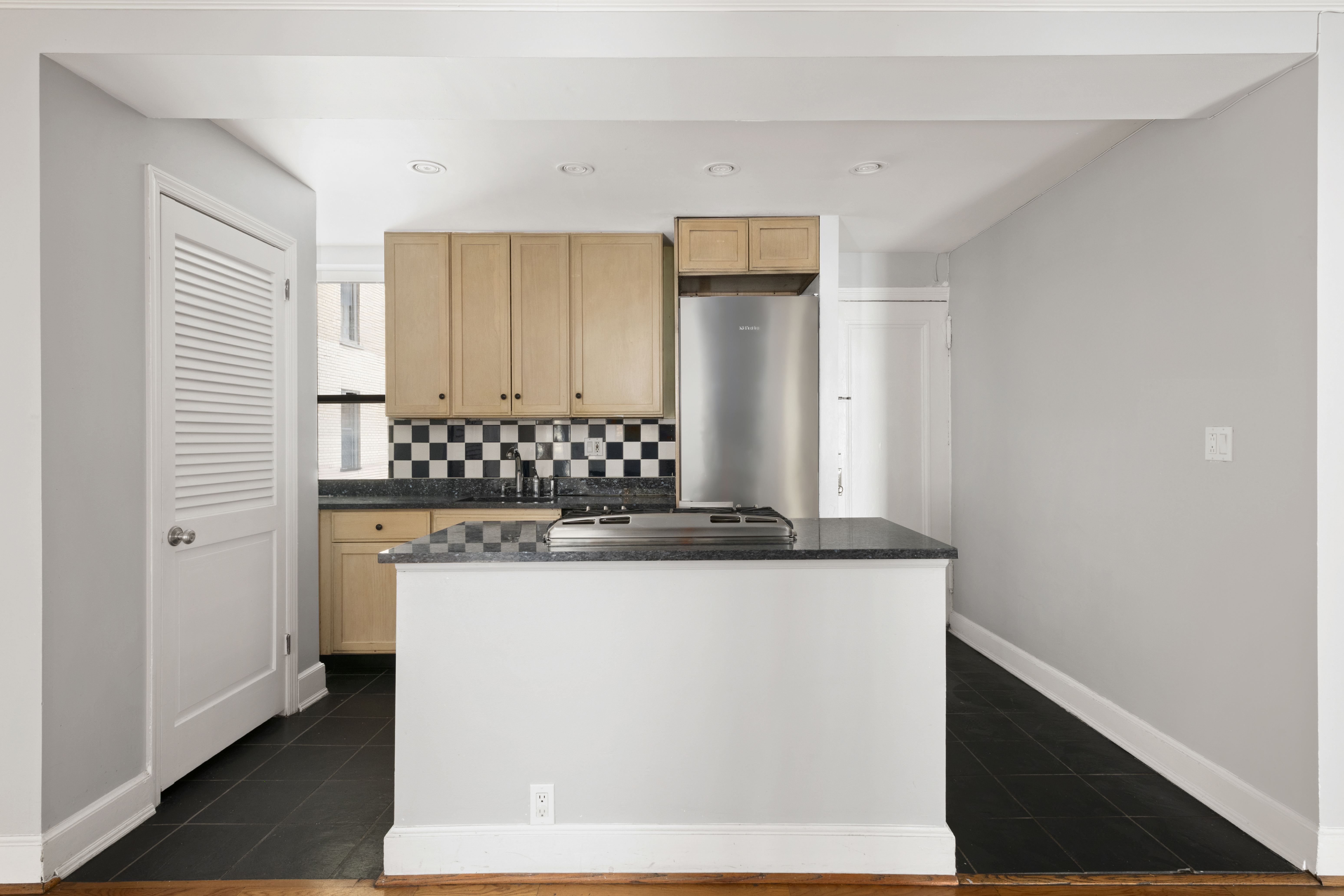 545 West End Avenue, Unit 7C Manhattan, NY 10024 - Photo 4 of 11 a view of cabinets with wooden floor