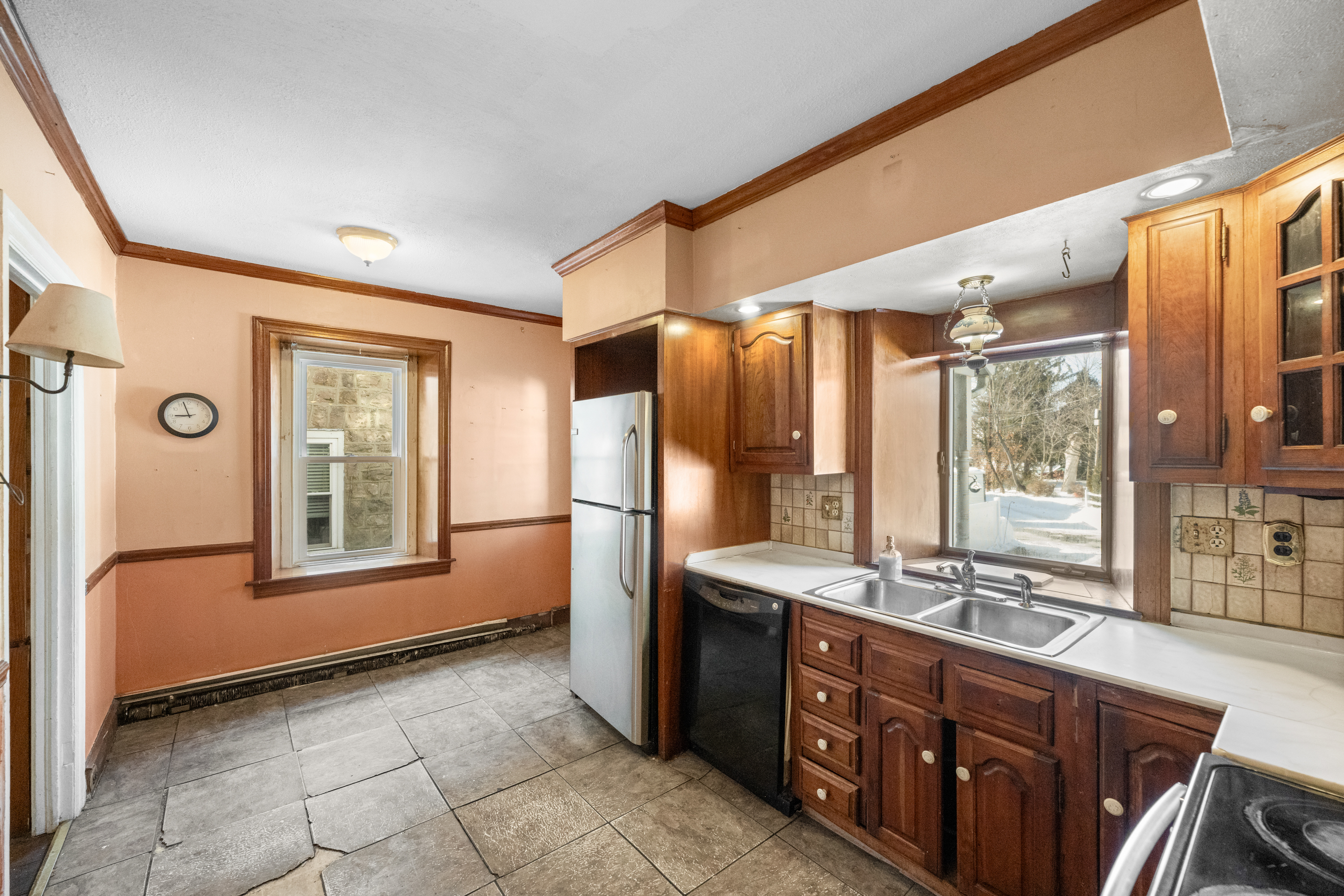 458 Renfrew Avenue Ambler, PA 19002 - Photo 11 of 32 a bathroom with a double vanity sink a mirror and a bathtub