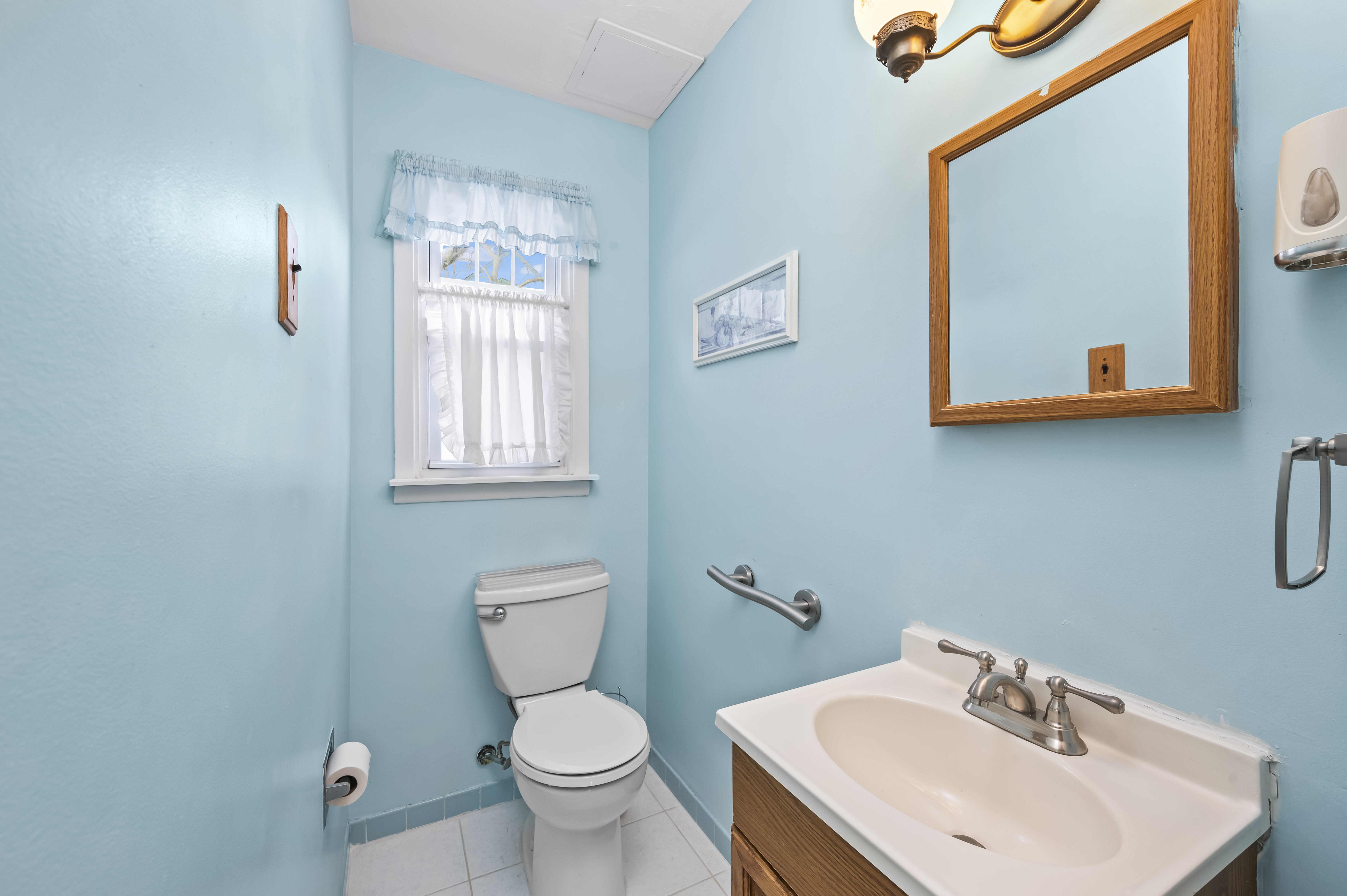 15 Area Place Staten Island, NY 10314 - Photo 11 of 27 a bathroom with a toilet a sink and mirror