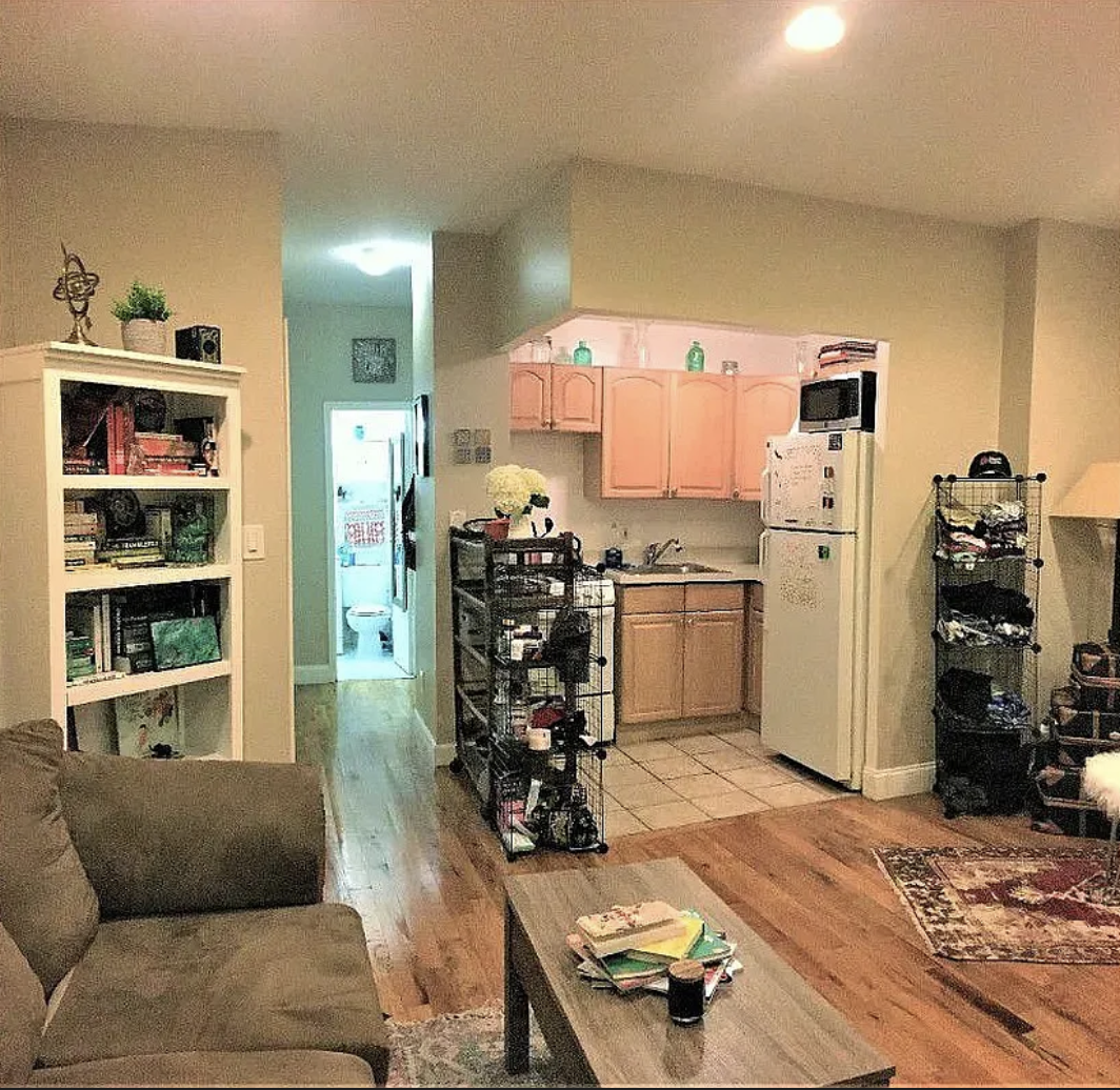 305 East 95th Street, Unit 4E Manhattan, NY 10128 - Photo 3 of 12 a living room with furniture window and wooden floor
