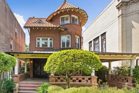 a front view of a house with garden