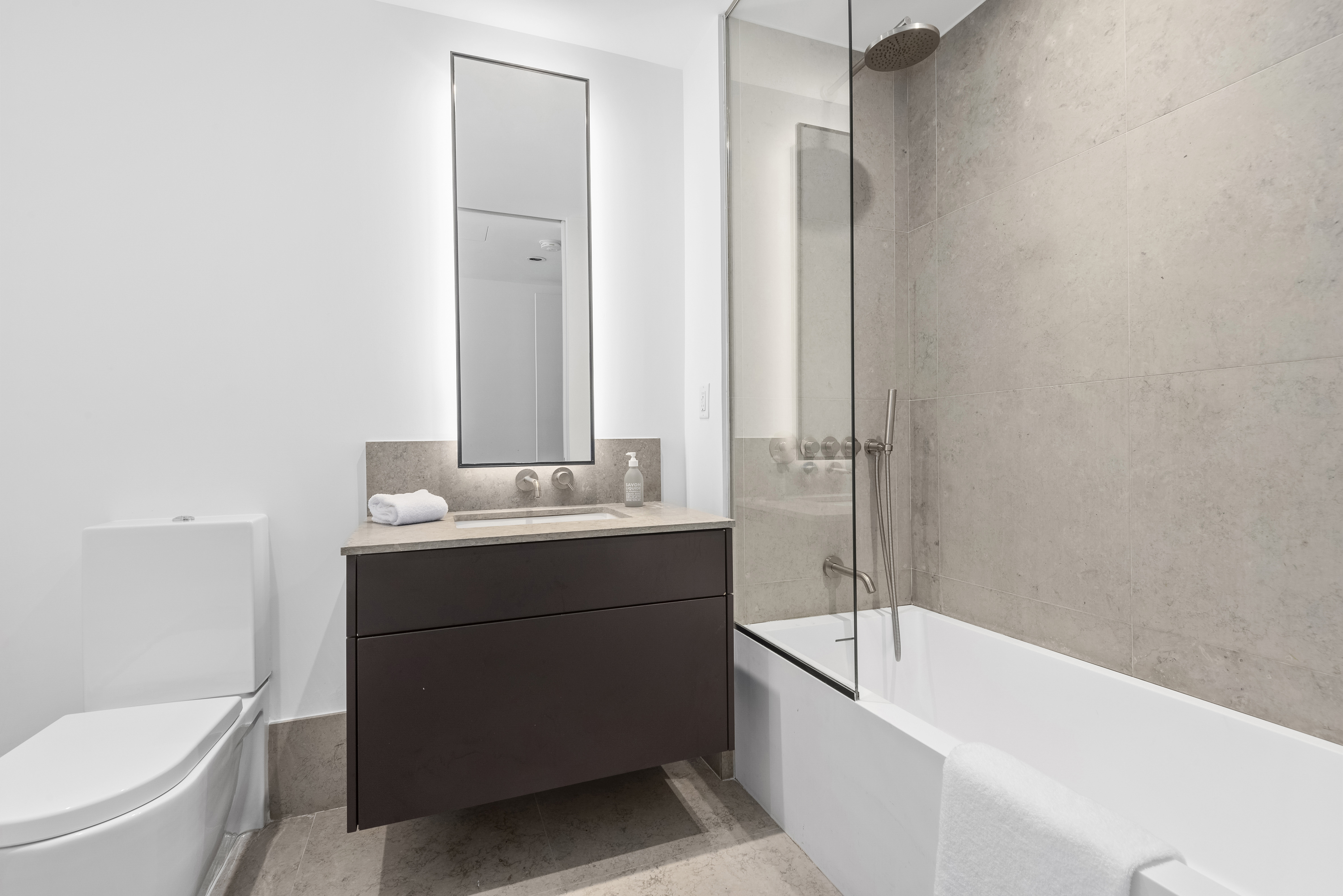 429 Kent Avenue, Unit L32 Brooklyn, NY 11249 - Photo 11 of 15 a bathroom with a sink a toilet and bathtub