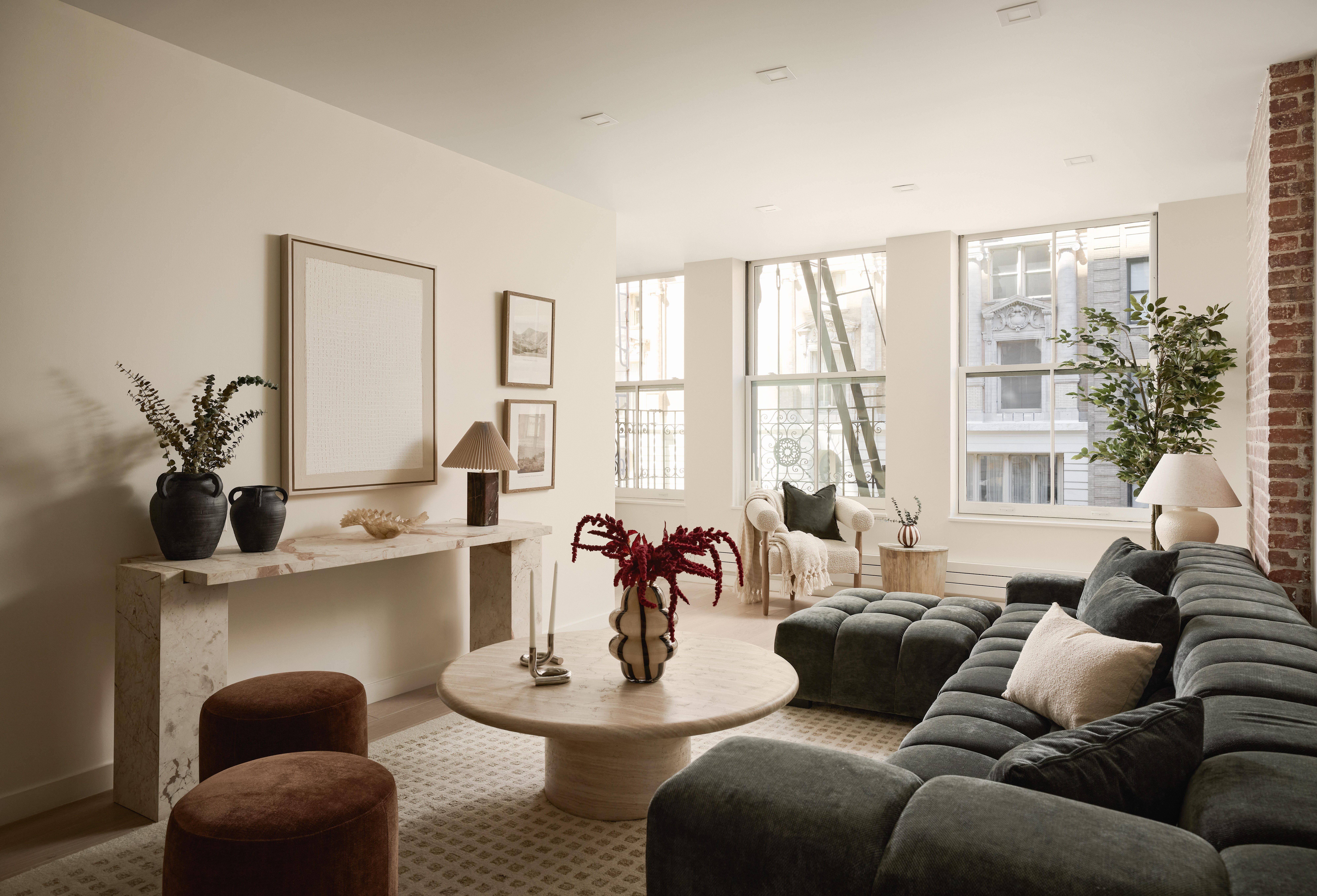 112 Hudson Street, Unit 3 Manhattan, NY 10013 - Photo 1 of 11 a living room with furniture and floor to ceiling windows