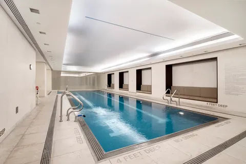 a view of a living room with hardwood floor