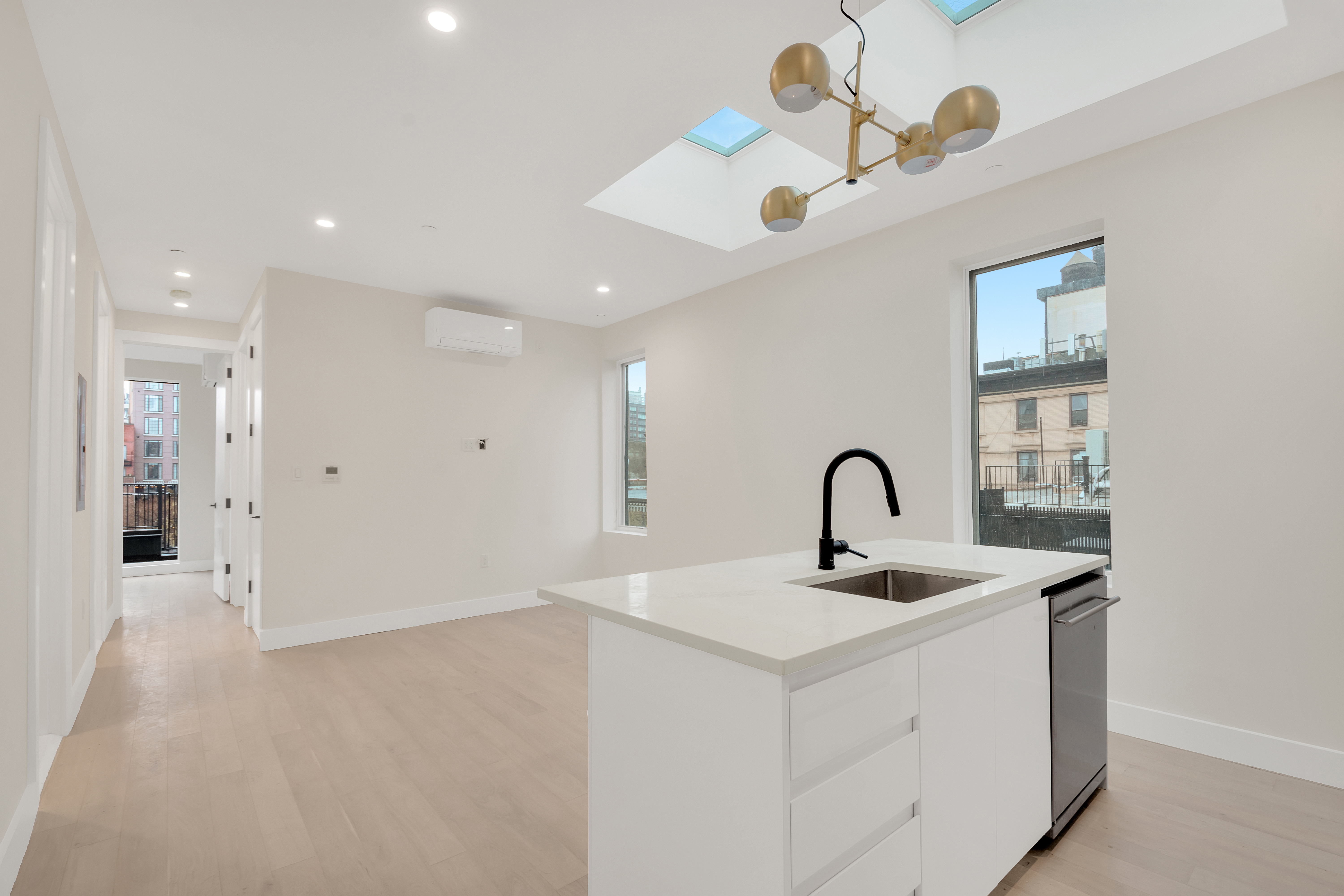 45 2nd Avenue, Unit 5 Manhattan, NY 10003 - Photo 2 of 8 a bathroom with a sink and a mirror