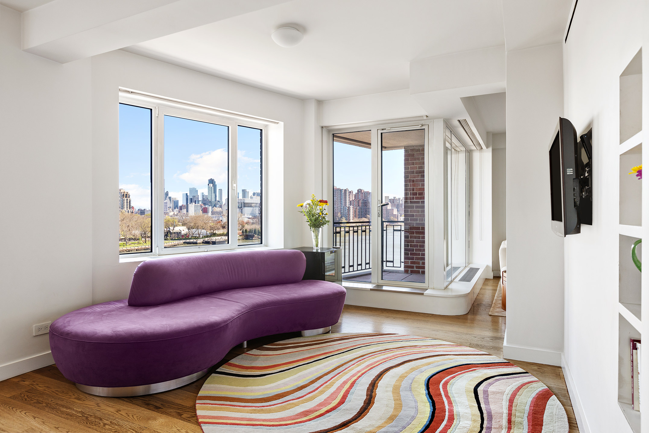 45 East End Avenue, Unit 6/7B Manhattan, NY 10028 - Photo 3 of 17 a living room with furniture and a floor to ceiling window