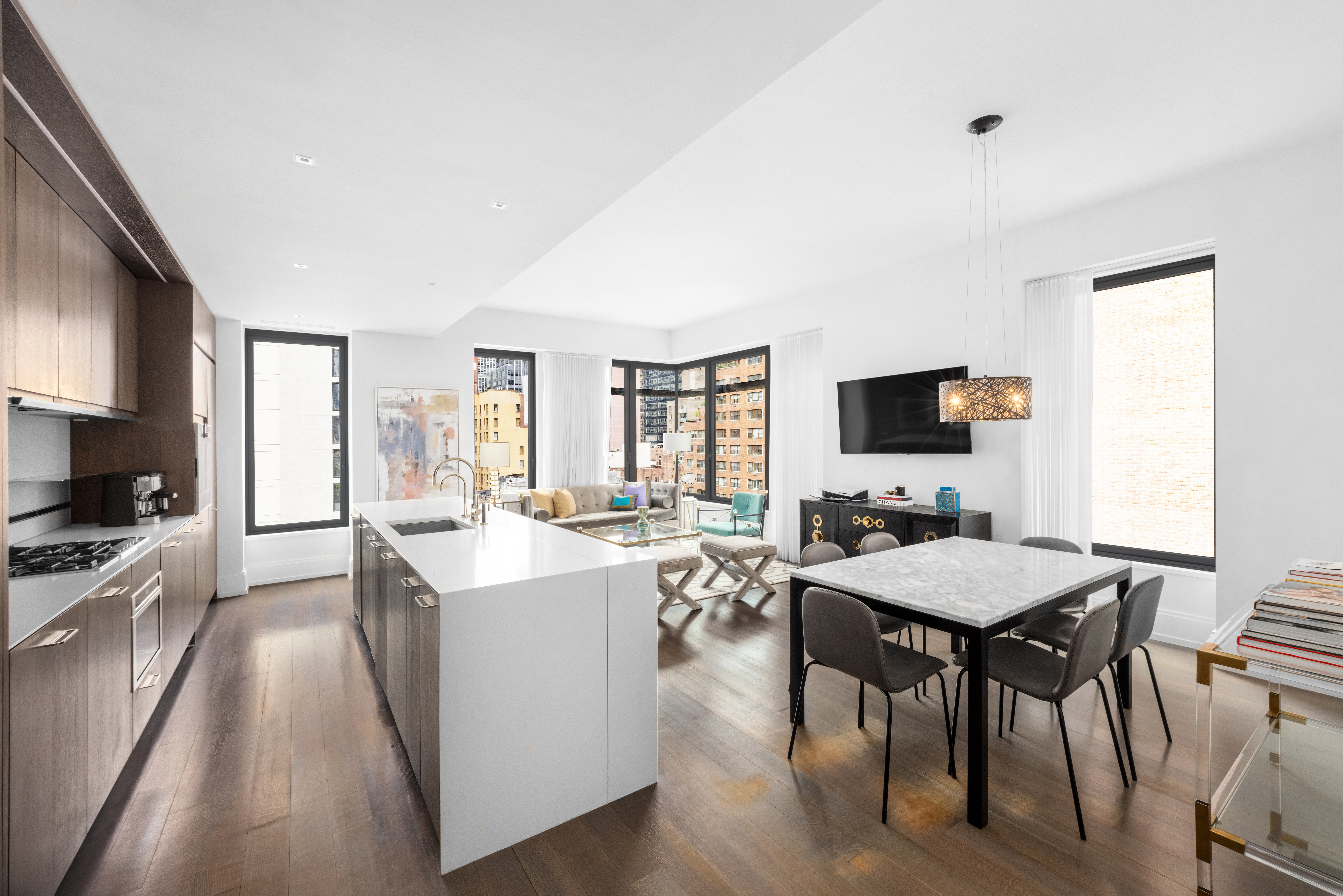 301 East 50th Street, Unit 8C Manhattan, NY 10022 - Photo 1 of 20 a view of a dining room with furniture window and wooden floor