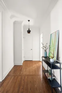 a view of workspace with furniture and wooden floor