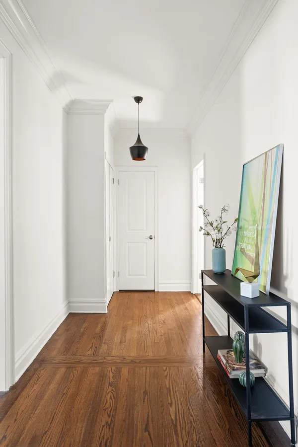 a view of workspace with furniture and wooden floor