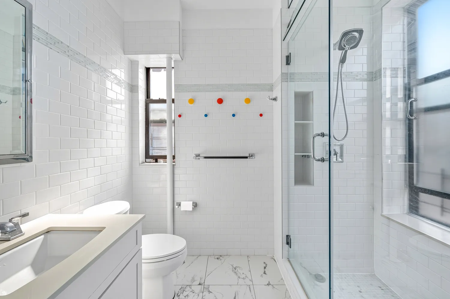 a bathroom with a sink toilet and shower