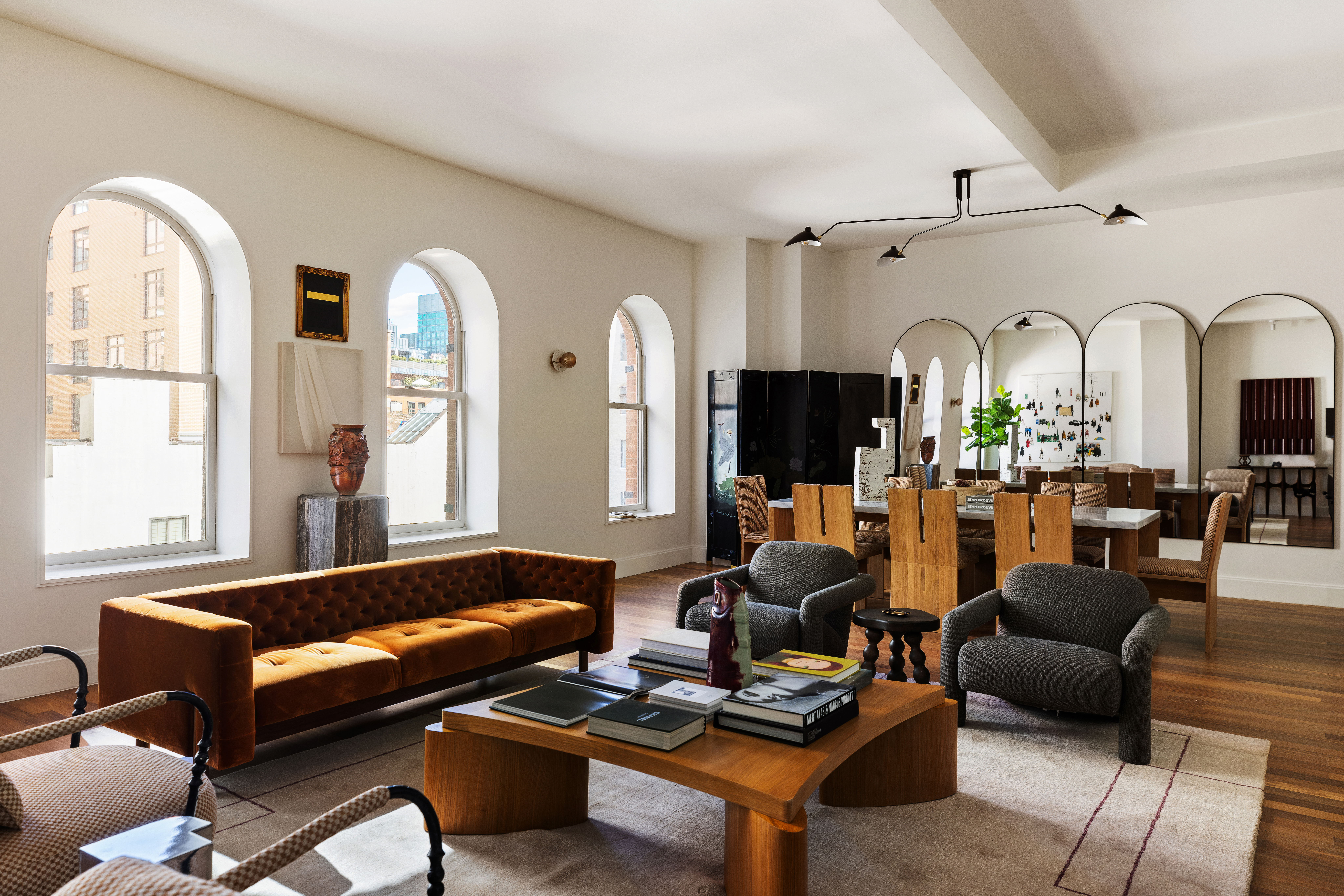 92 Laight Street, Unit 5E Manhattan, NY 10013 - Photo 5 of 26 a living room with furniture fireplace and a large window