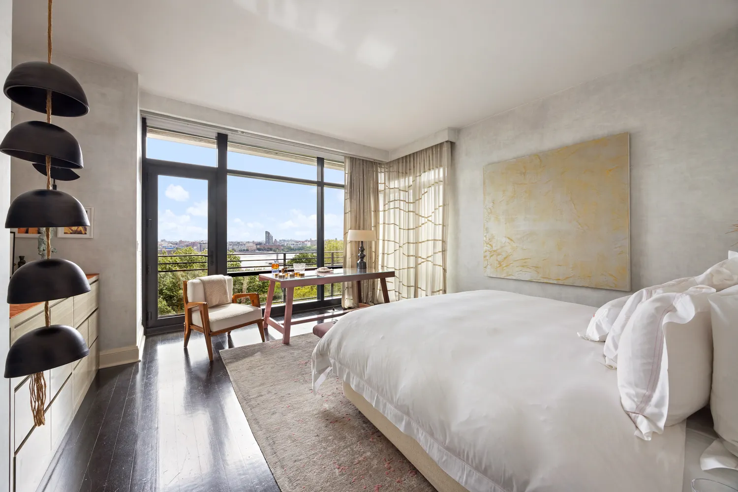 a spacious bedroom with a large bed and a large window