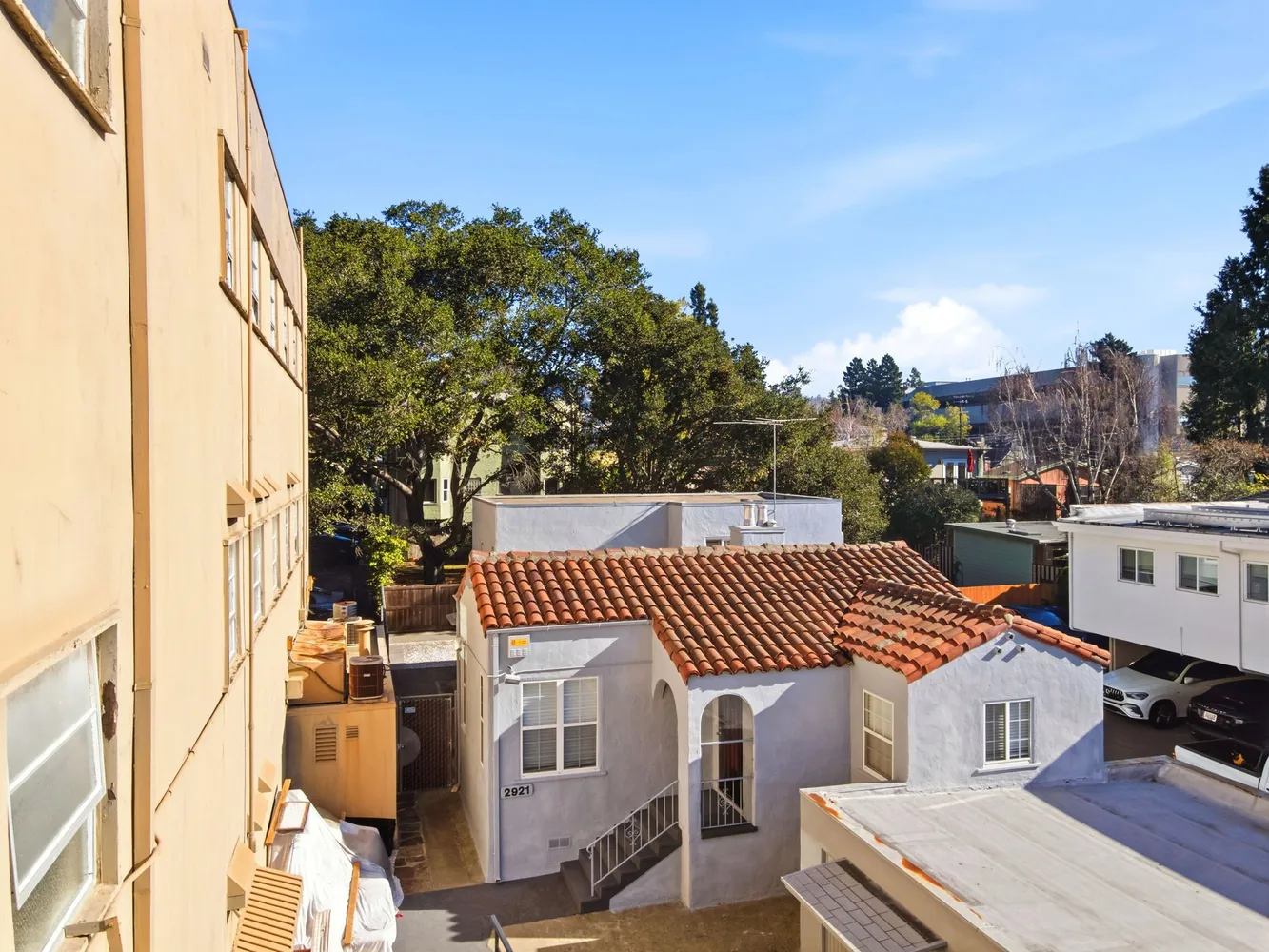a view of a patio with table and chairs with wooden floor and fence