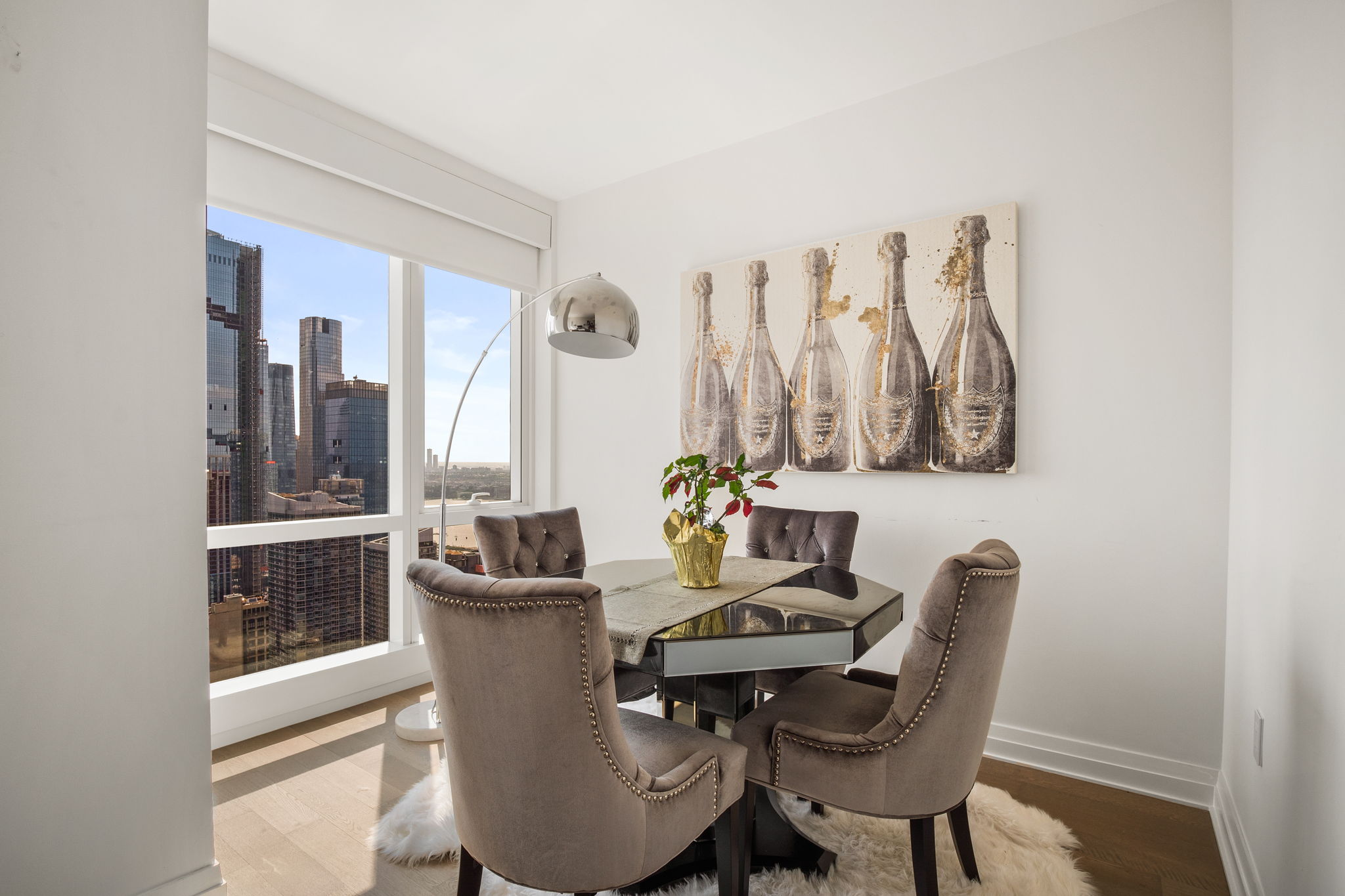 460 West 42nd Street, Unit 55F Manhattan, NY 10036 - Photo 3 of 9 a dining room with furniture and window