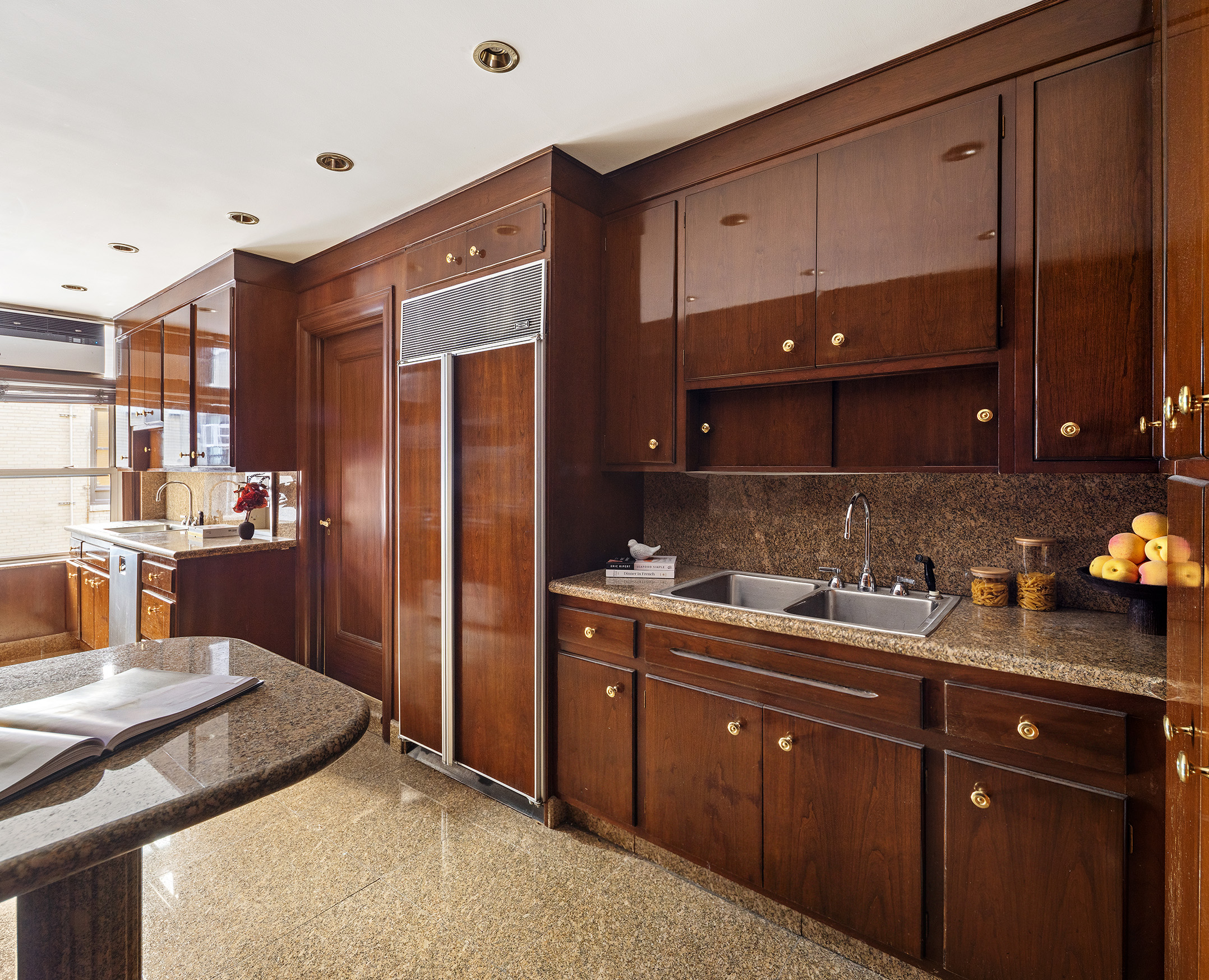 875 Park Avenue, Unit 11C Manhattan, NY 10075 - Photo 11 of 25 a kitchen with a sink and cabinets