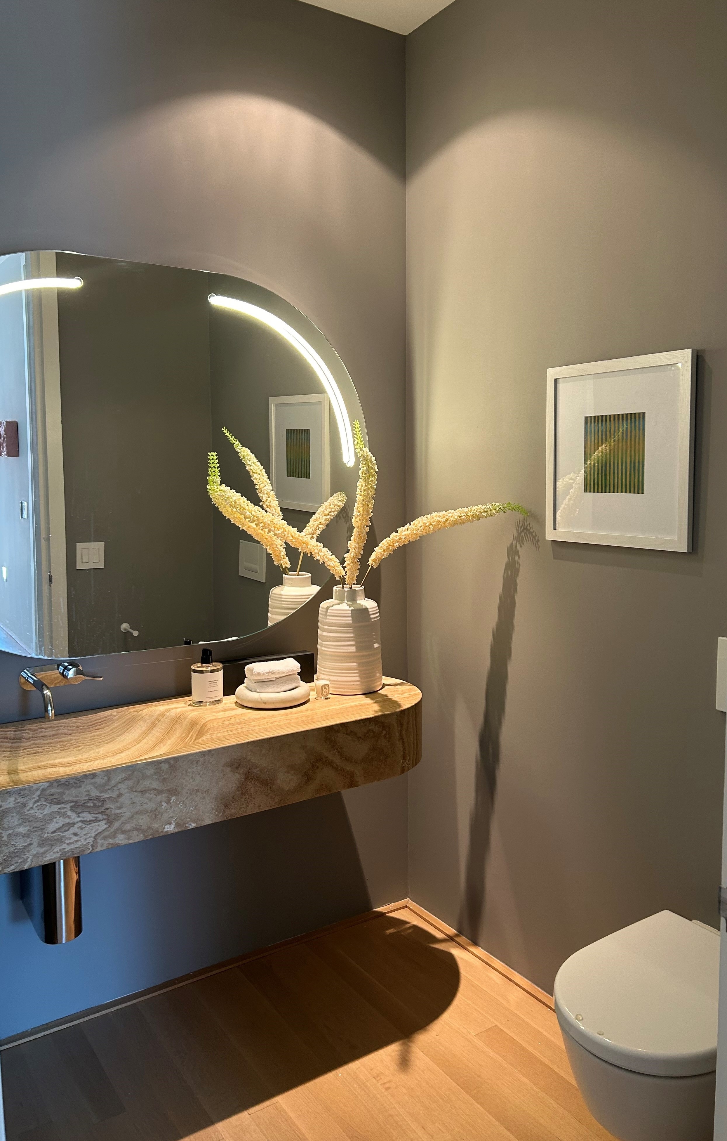 56 Leonard Street, Unit 14BEAST Manhattan, NY 10013 - Photo 10 of 35 a bathroom with a sink a toilet and mirror