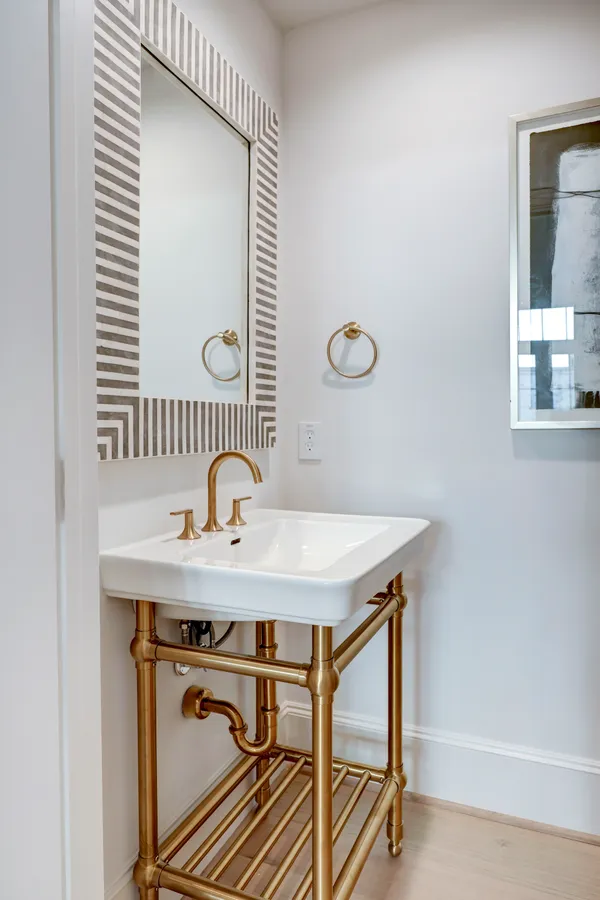 a bathroom with a sink a mirror and a window