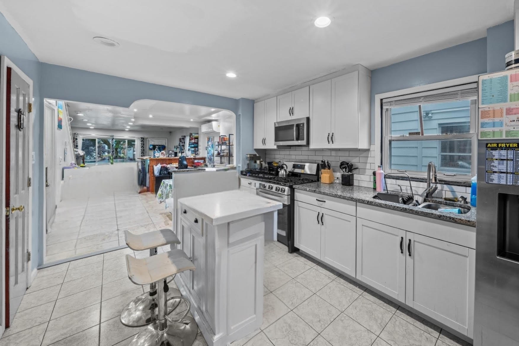 1419 East 54th Street Brooklyn, NY 11234 - Photo 7 of 19 a kitchen with stainless steel appliances granite countertop a sink and cabinets