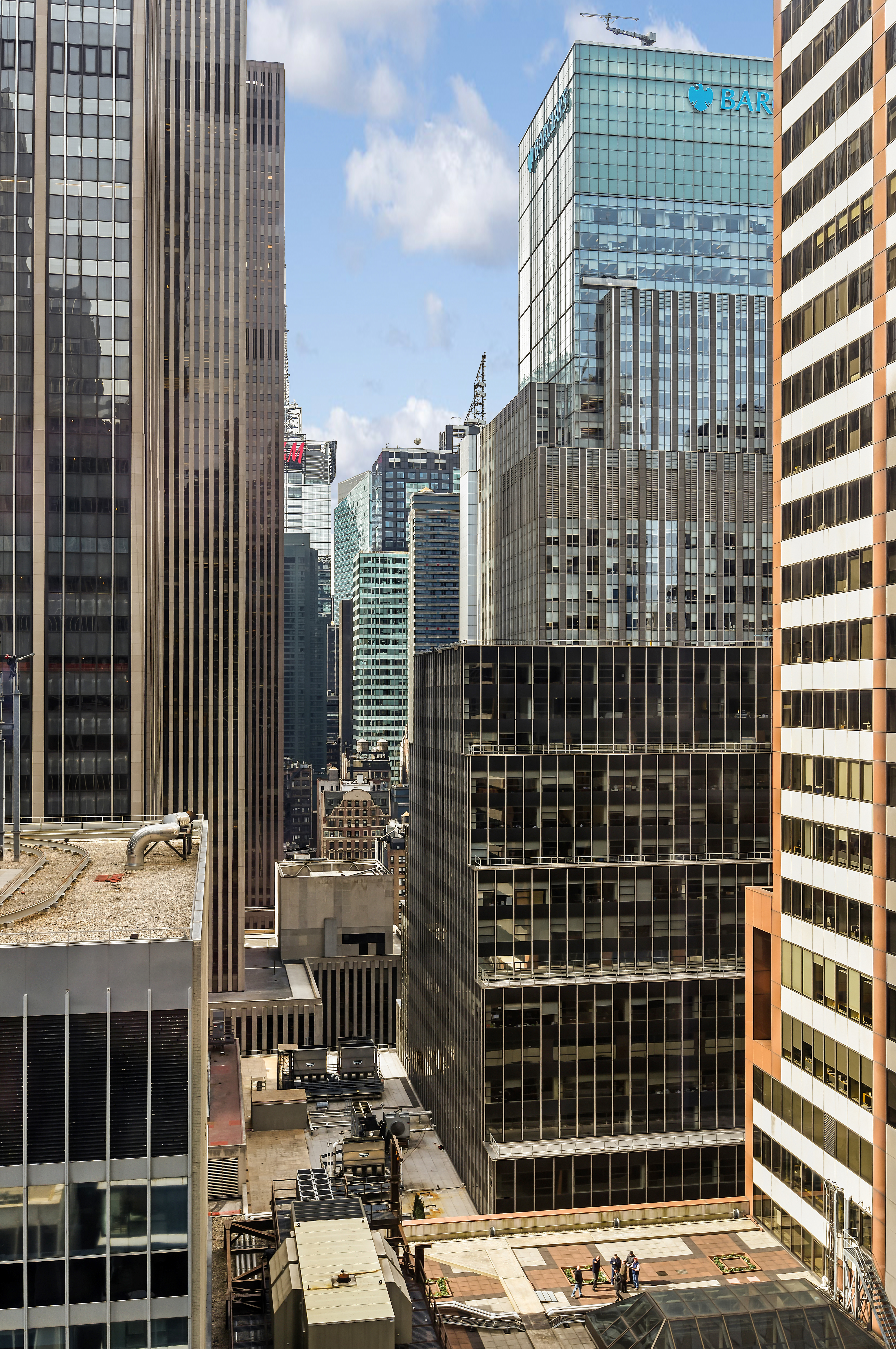135 West 52nd Street, Unit 23C Manhattan, NY 10019 - Photo 6 of 19 a front view of a building with glass door
