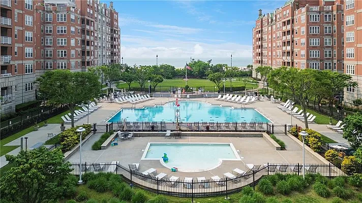 105 Oceana Drive East, Unit PH1D Brooklyn, NY 11235 - Photo 25 of 27 a view of a swimming pool with a garden