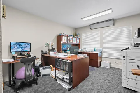 a room with furniture a bed and a window