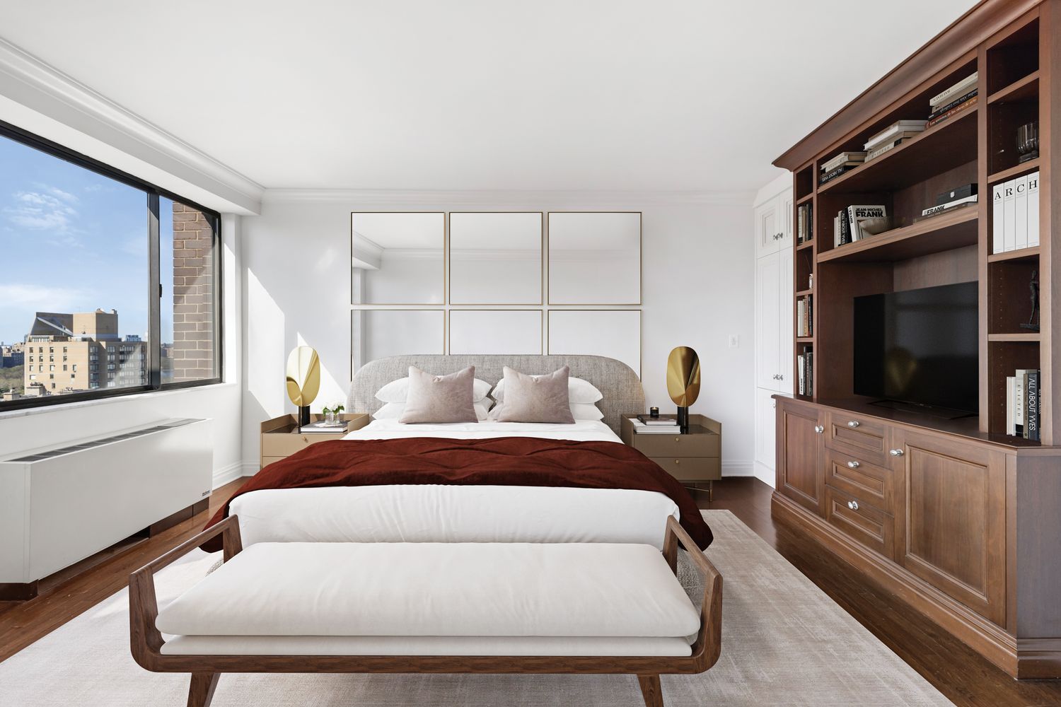 40 East 80th Street, Unit 25A Manhattan, NY 10075 - Photo 10 of 18 a bed room with a bed a flat screen tv and dresser