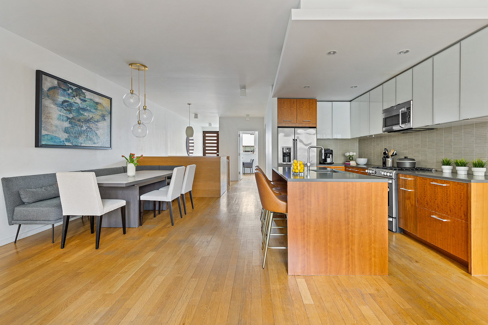 115 3rd Street, Unit 1 Brooklyn, NY 11231 - Photo 4 of 13 a living room with stainless steel appliances dining table furniture wooden floor and a kitchen view