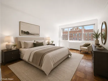 a bedroom with a bed and glass window