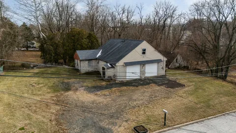 a house with trees in the background