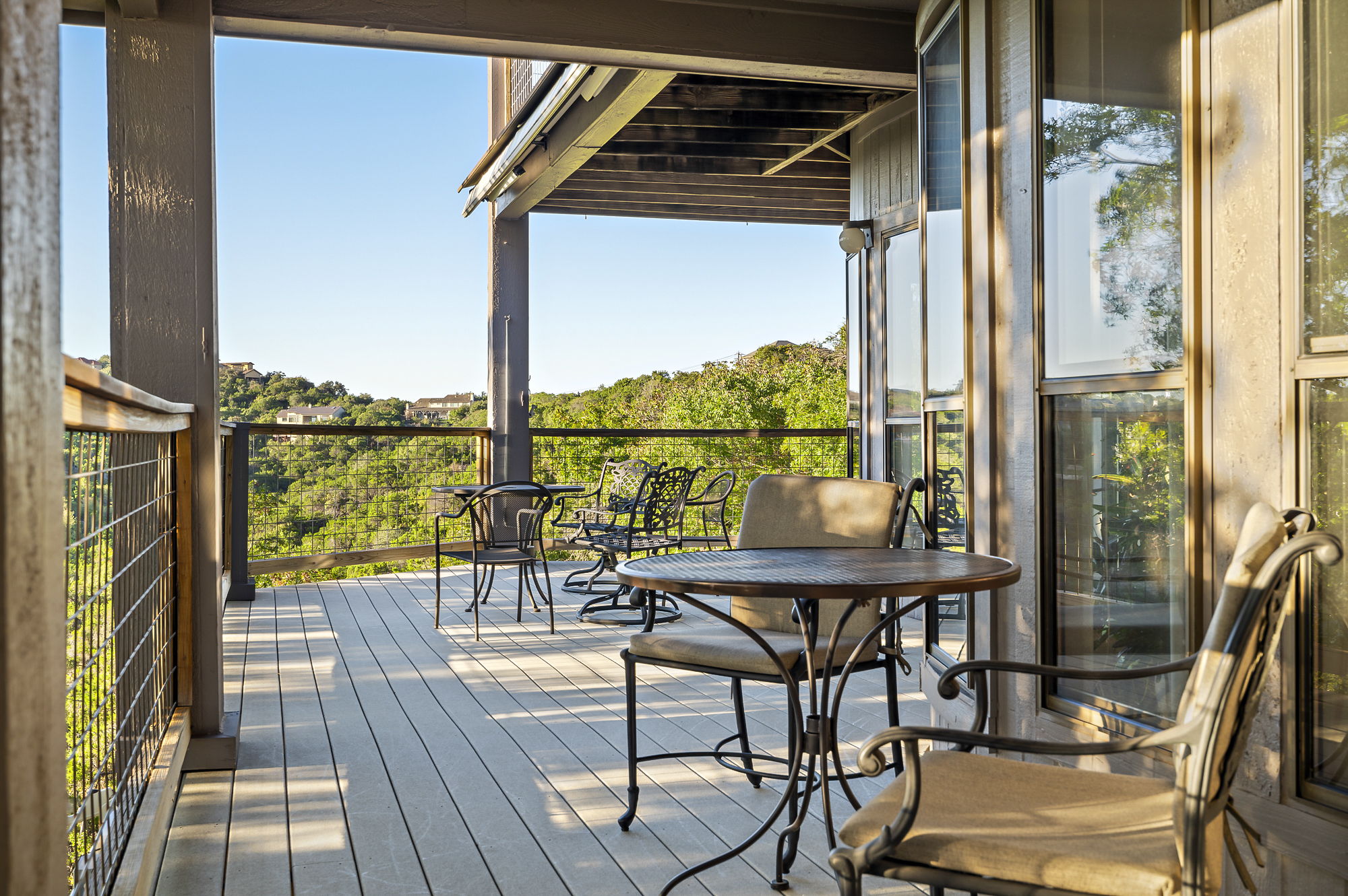 1605 The High Road Austin, TX 78746 - Photo 17 of 45 a view of a balcony with chairs and a table of the balcony