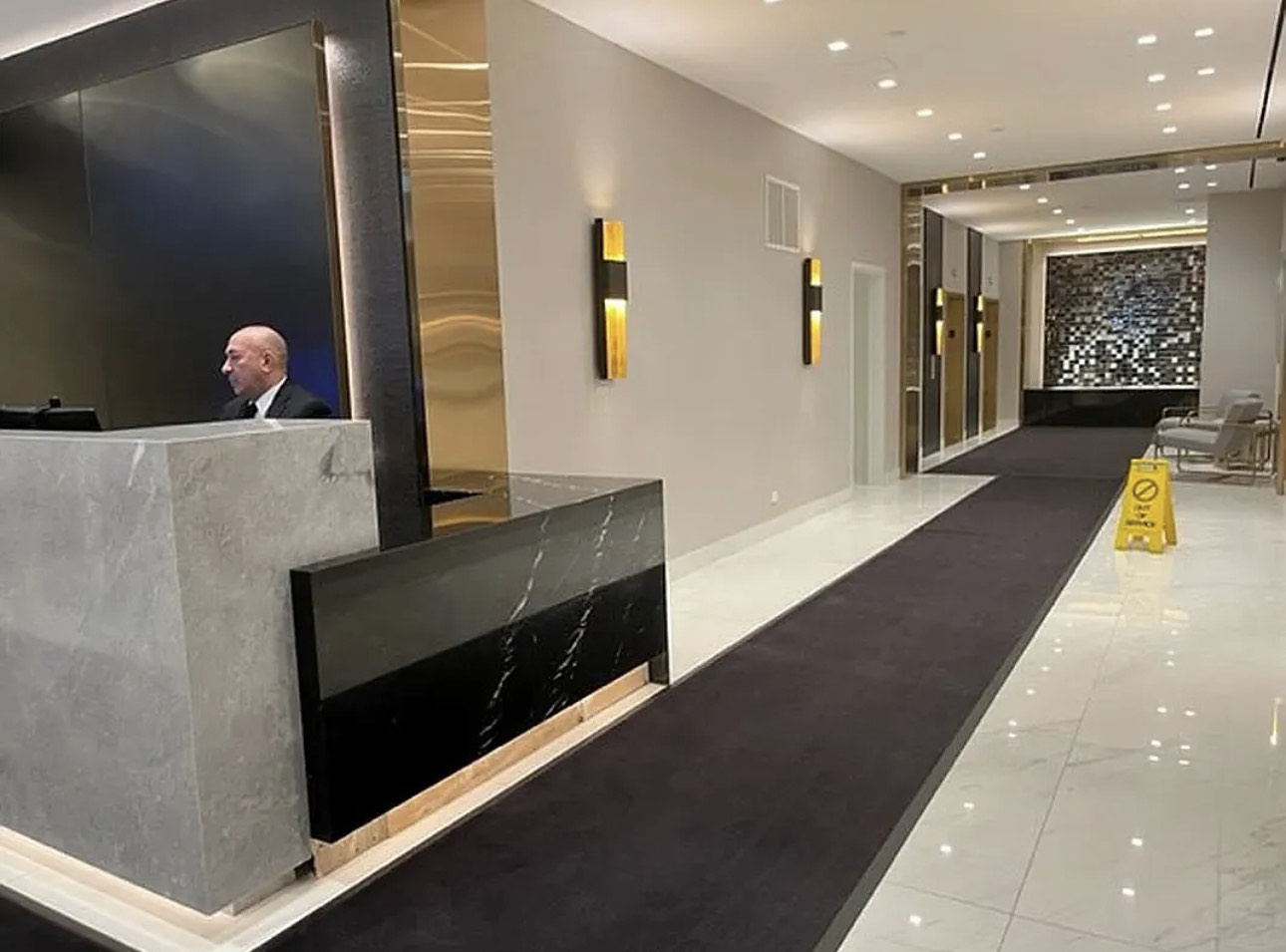 150 West 51st Street, Unit 1528 Manhattan, NY 10019 - Photo 13 of 21 a lobby with furniture and wooden floor