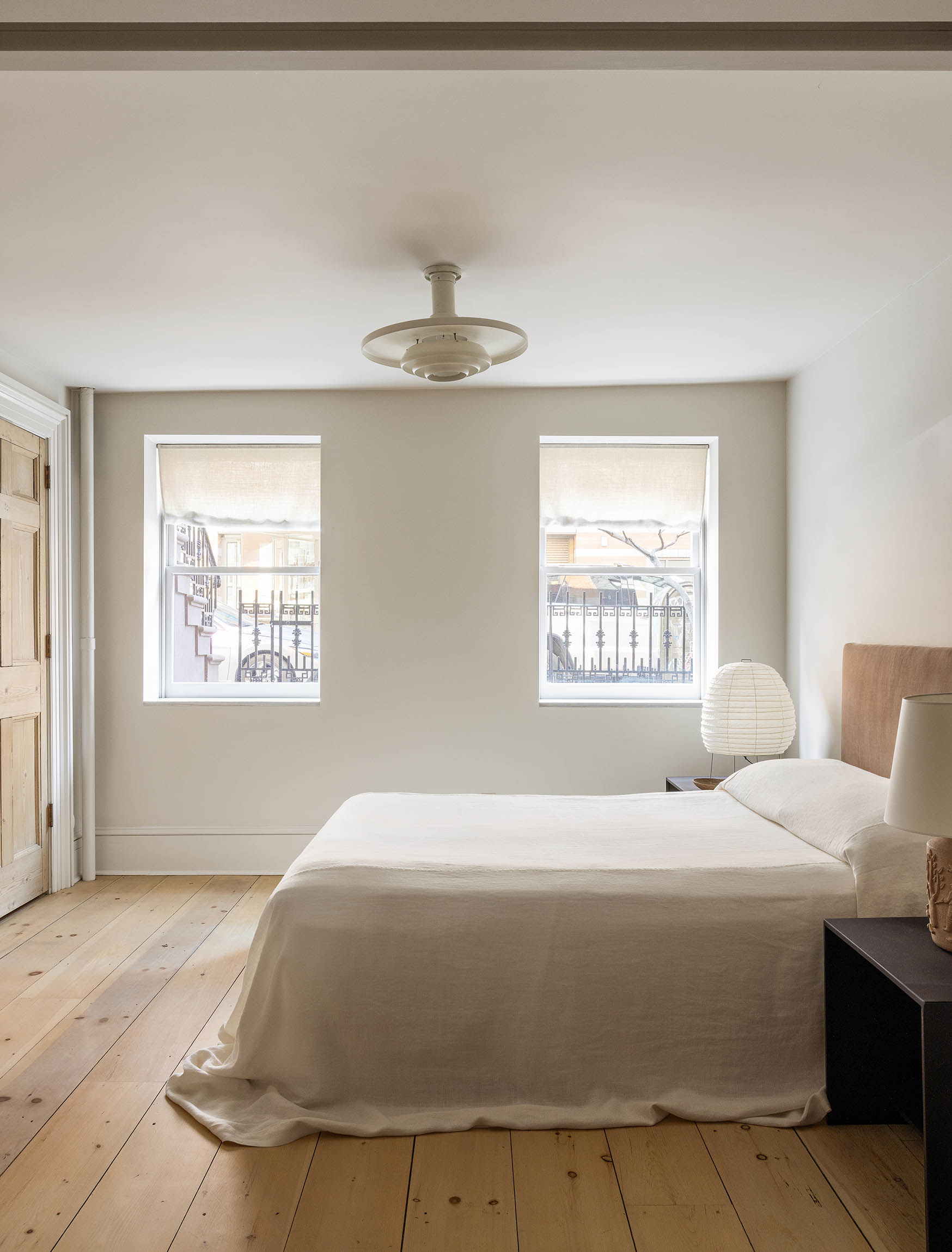 125 West 15th Street Manhattan, NY 10011 - Photo 16 of 28 a bedroom with a bed and a window